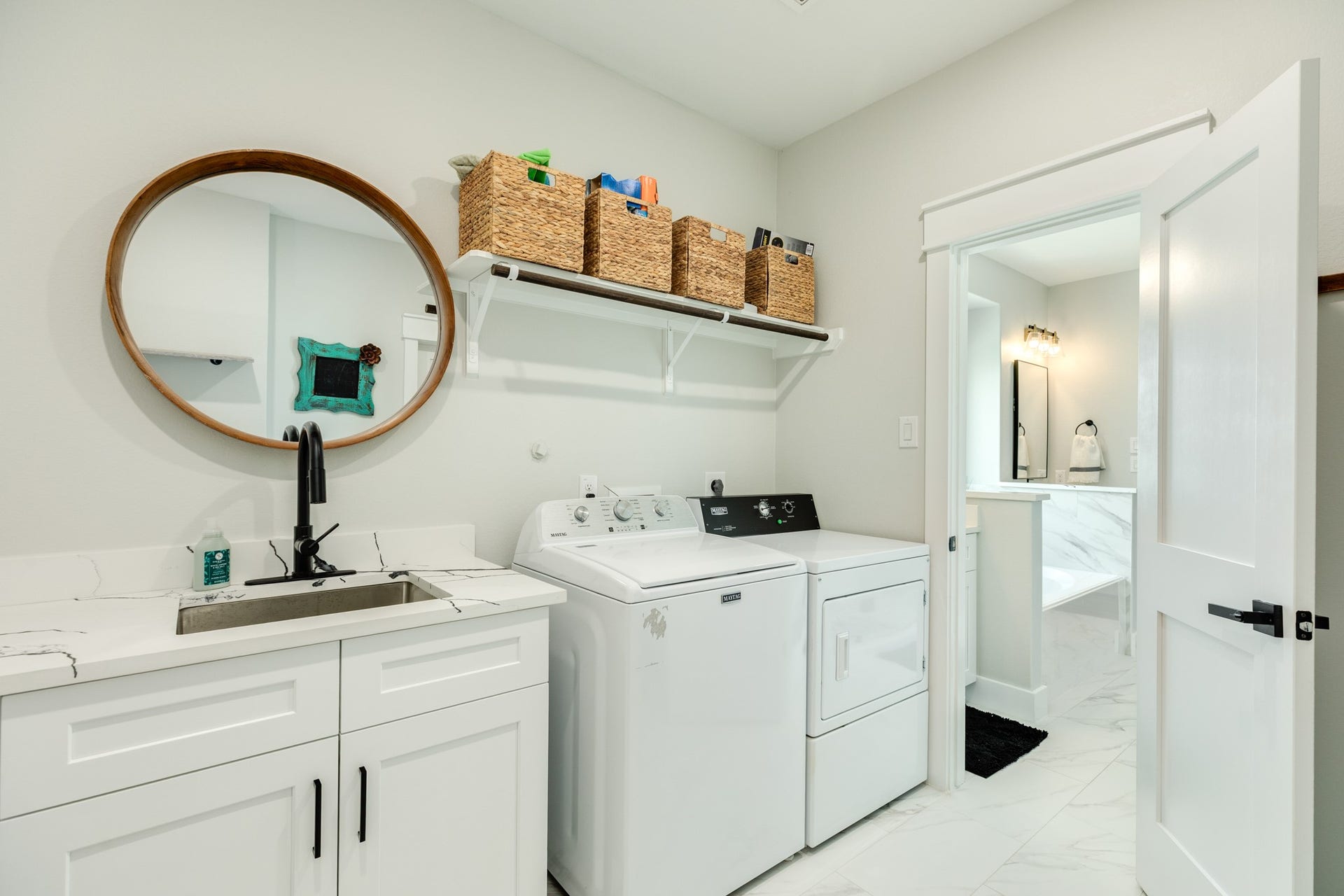 608 Angus Trail, Angleton, TX 77515 Oversized utility room with a sink and extra cabinetry.