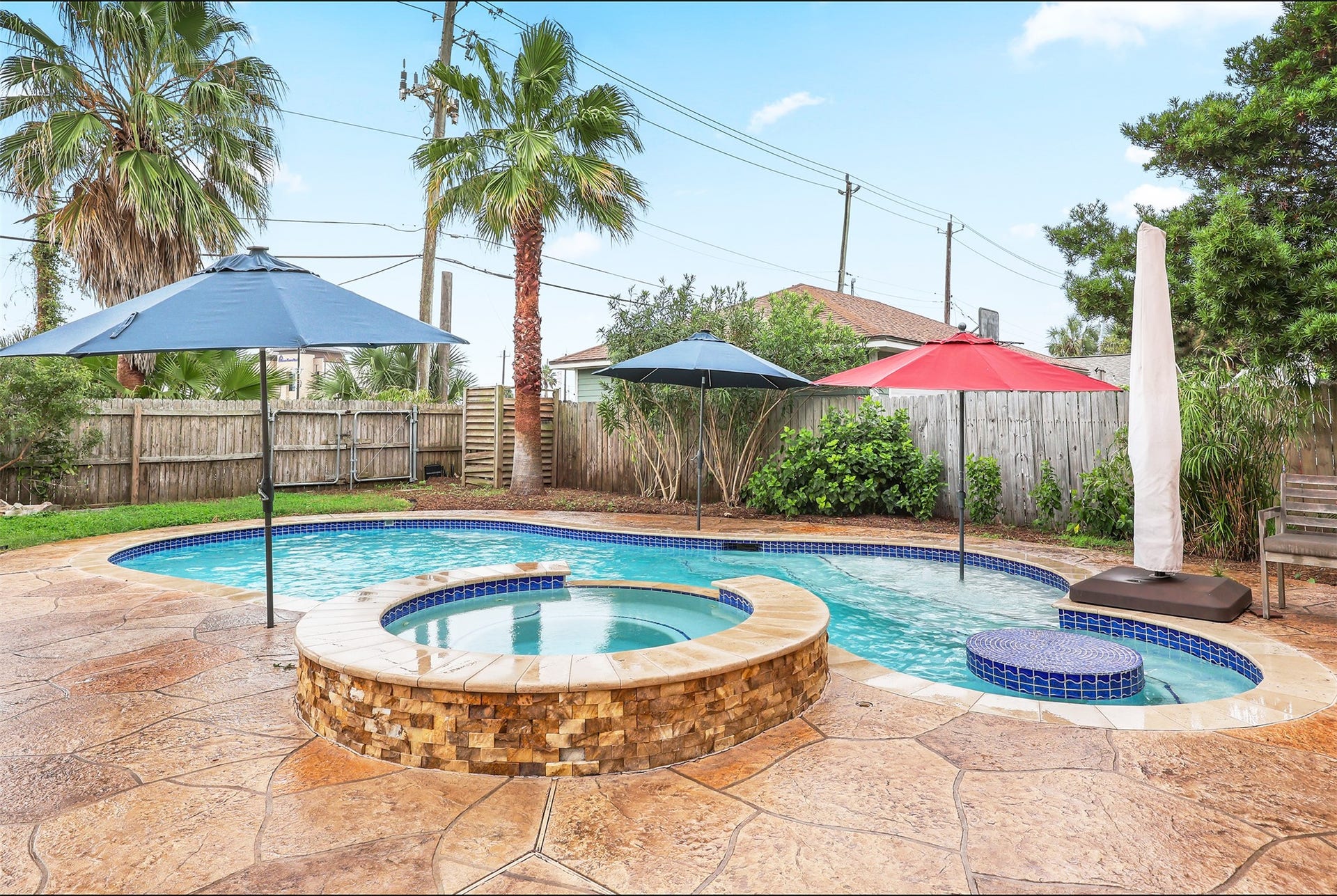 4323 Sherman Boulevard, Galveston, TX 77550 Inviting backyard oasis with stunning pool and spa.