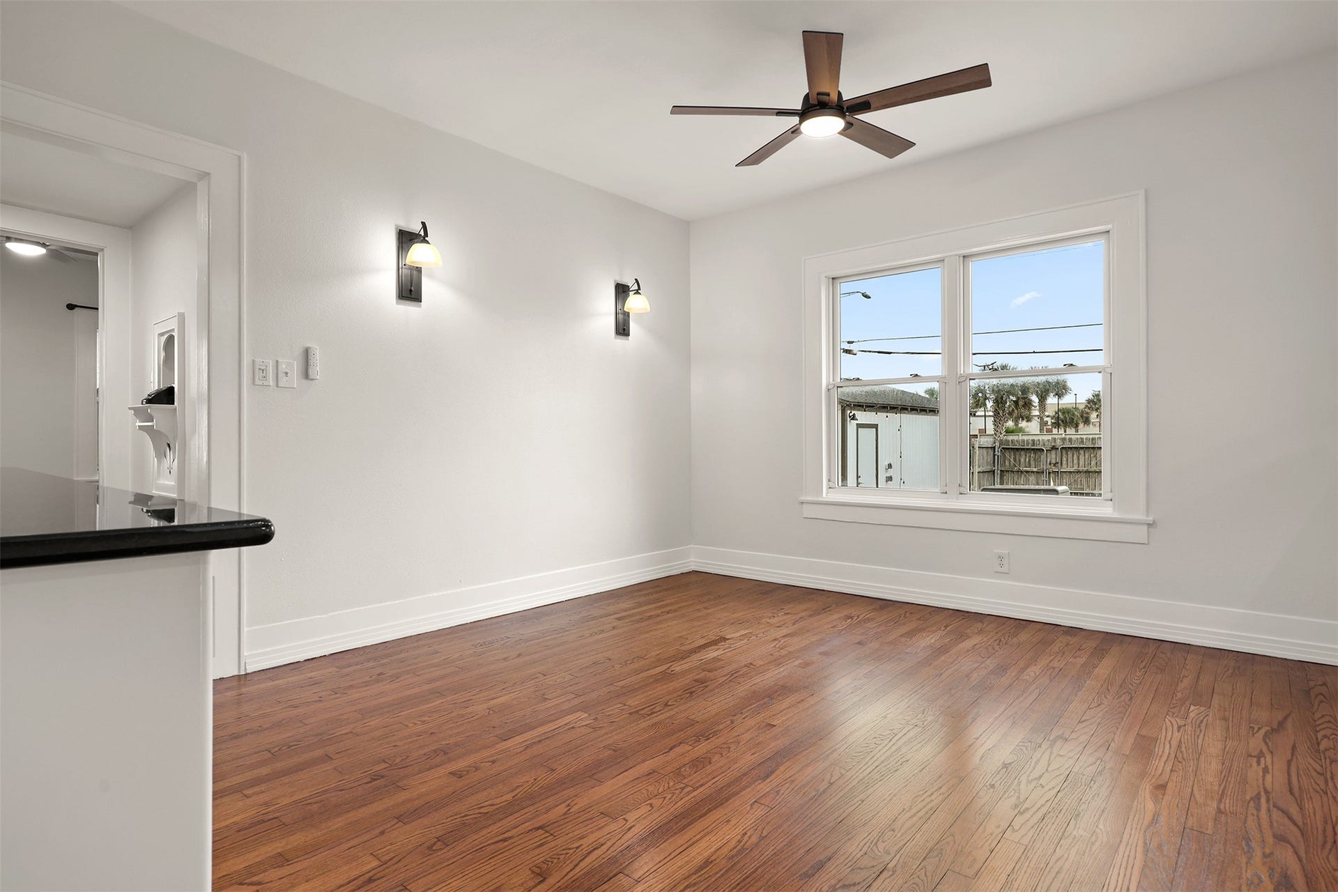 4323 Sherman Boulevard, Galveston, TX 77550 Bright and airy dining room with large windows overlooking the backyard.