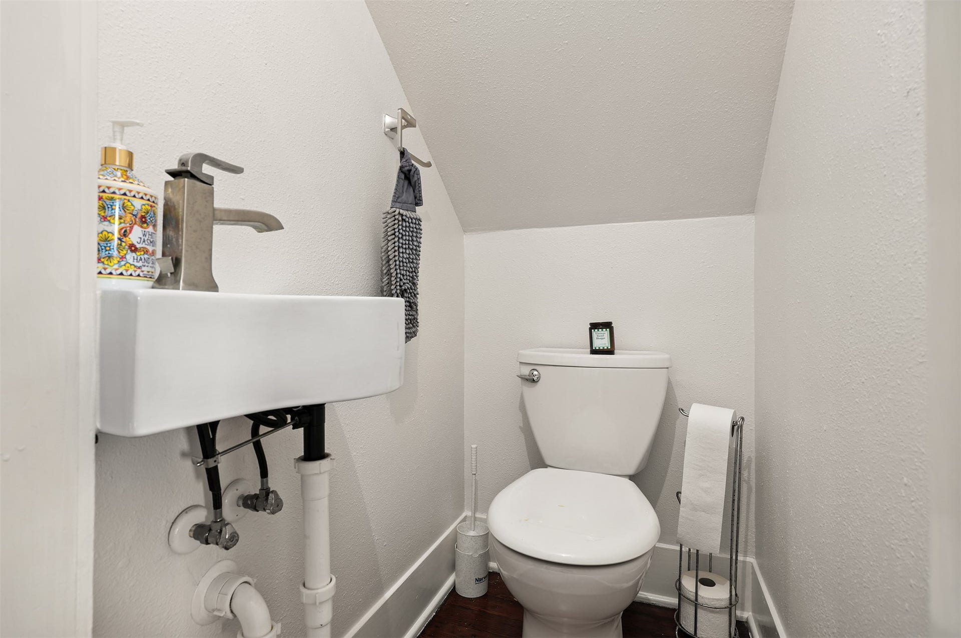 4323 Sherman Boulevard, Galveston, TX 77550 Cozy half-bath with a modern sink and efficient use of space, perfect for guests.