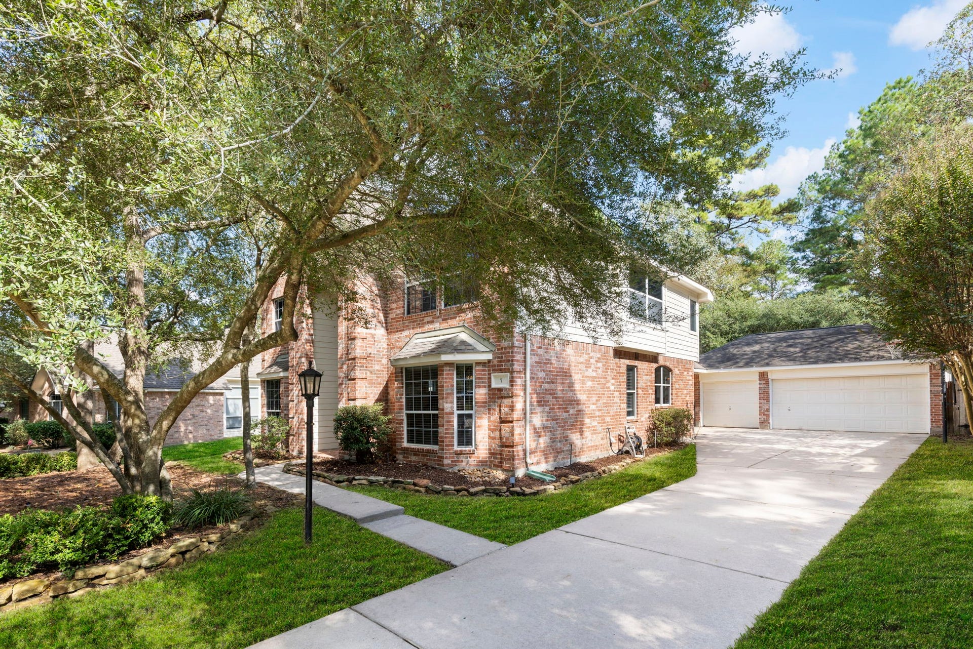 7 S Acacia Park Circle, The Woodlands, TX 77382 Sod in some photos is virtually enhanced.