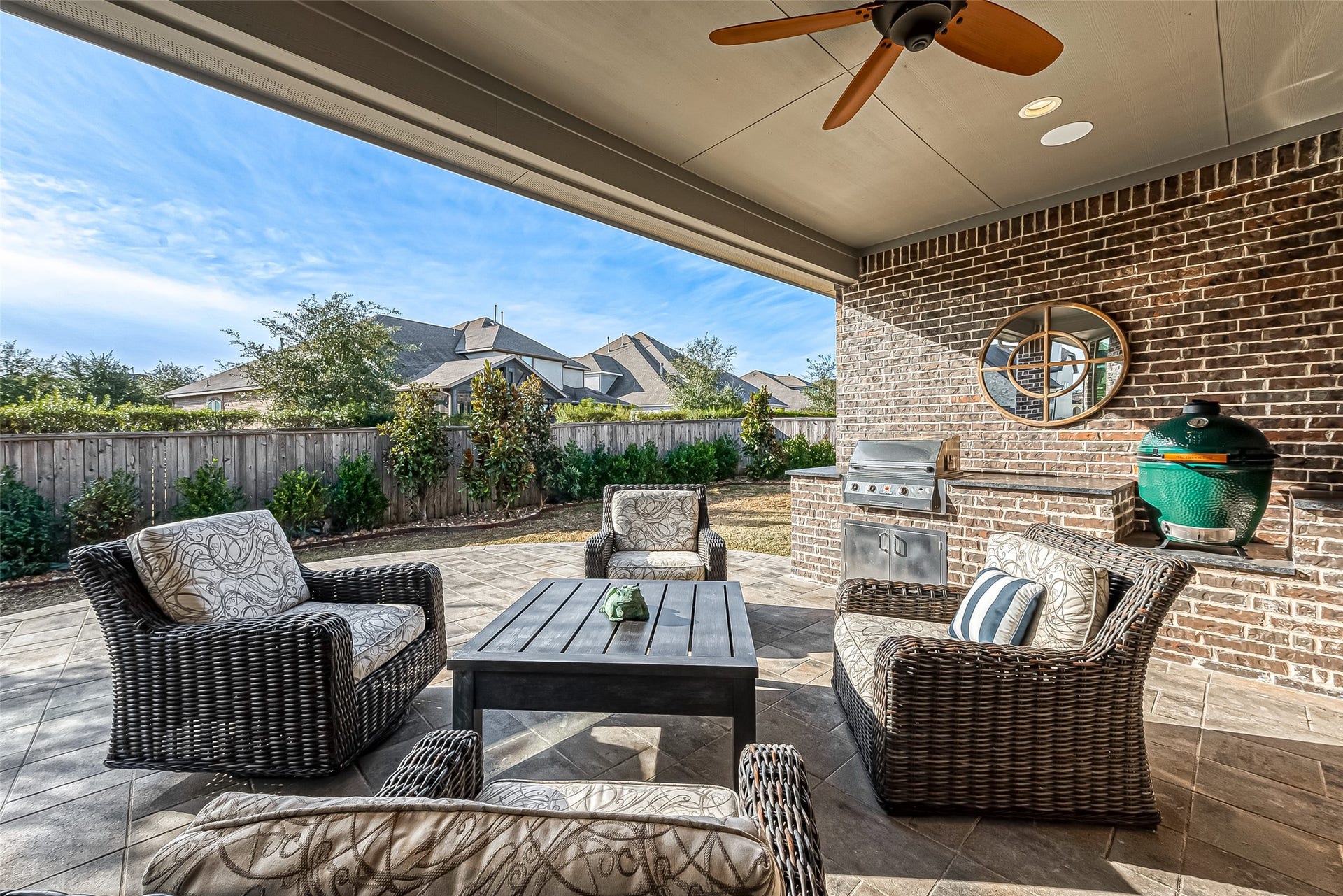 30 Argosy Bend Place, Tomball, TX 77375 Recently added extended back patio and built-in outdoor kitchen. Grill stays but green egg does not.
