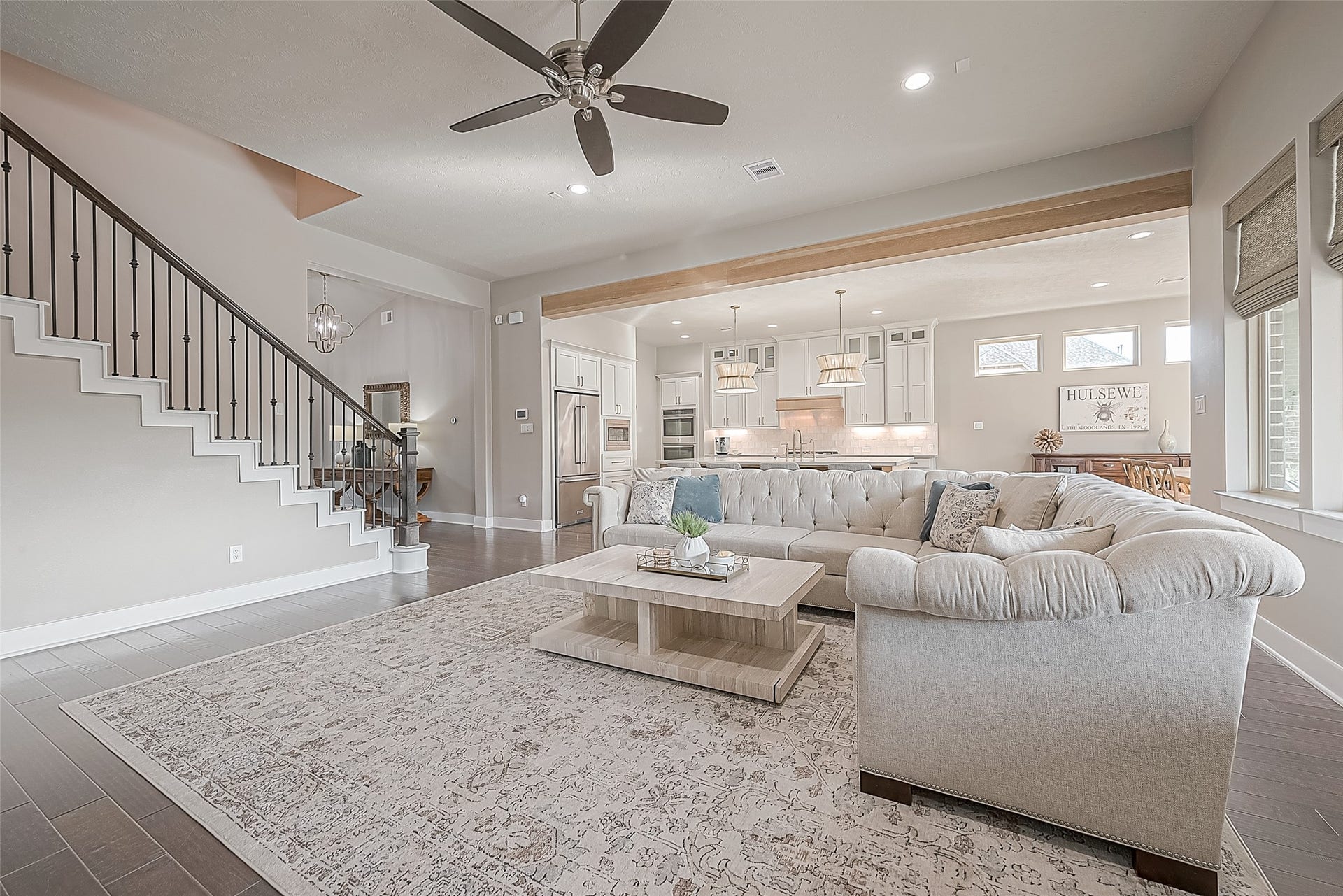 30 Argosy Bend Place, Tomball, TX 77375 The view of the open-concept living and kitchen area is separated by the newly added warm wood beam.