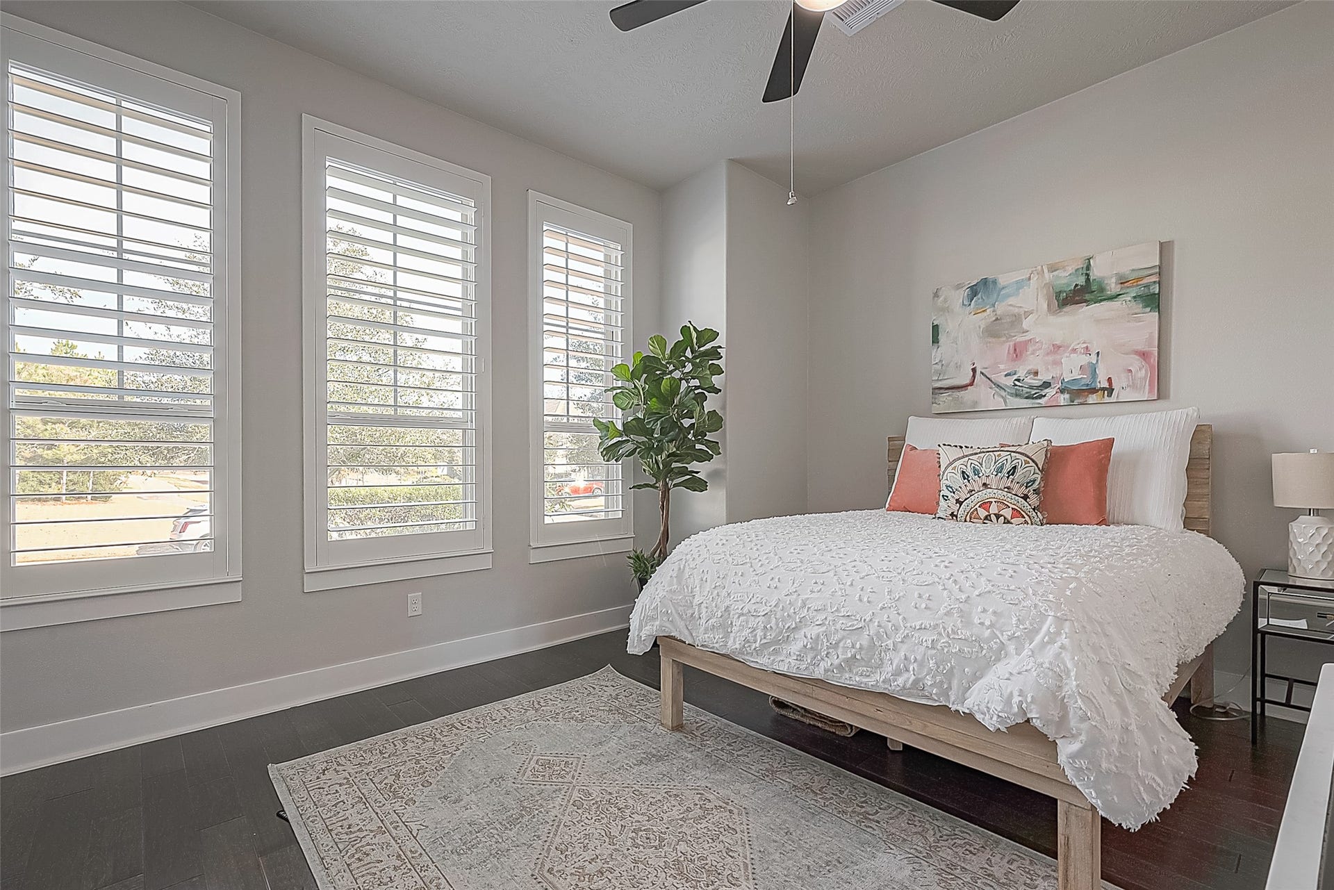 30 Argosy Bend Place, Tomball, TX 77375 The first of three secondary rooms - this one faces the front of the home. All rooms have wood flooring, Plantation shutters, and ceiling fans.