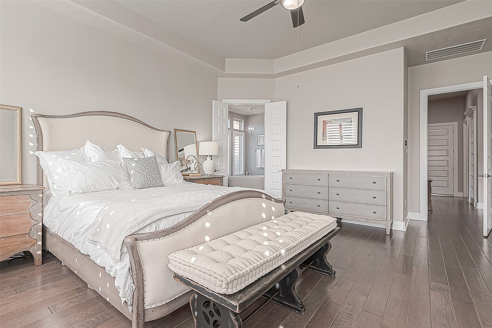 30 Argosy Bend Place, Tomball, TX 77375 Primary bedroom showing view of garage door to the right and en suite bath to the left.