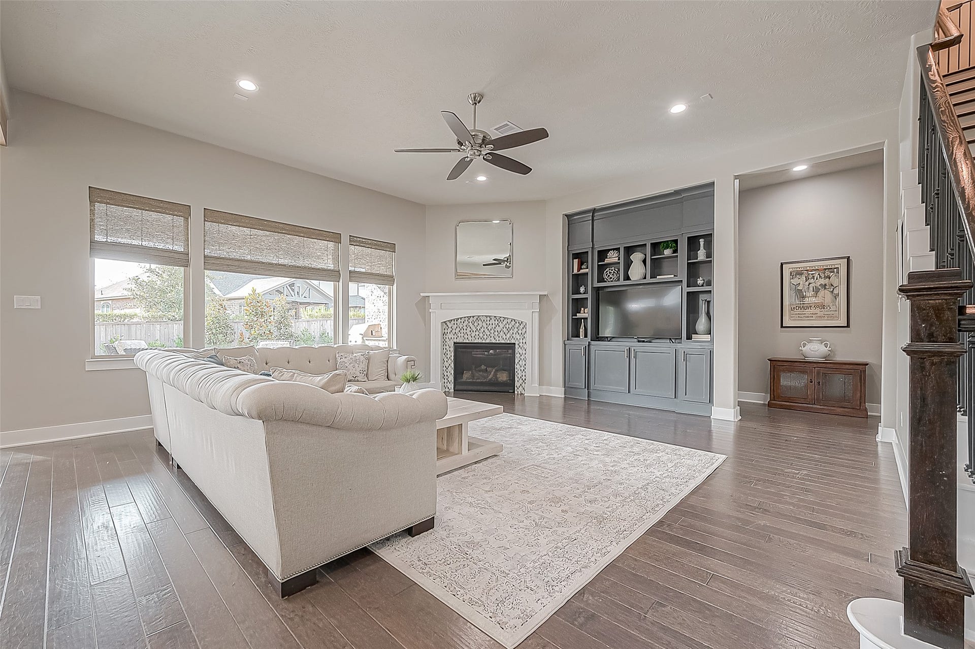 30 Argosy Bend Place, Tomball, TX 77375 The living area is large enough to accommodate many different seating options. The custom cabinetry houses a TV and has plenty of storage. The corner fireplace keeps things cozy on brisk mornings or cool nights.