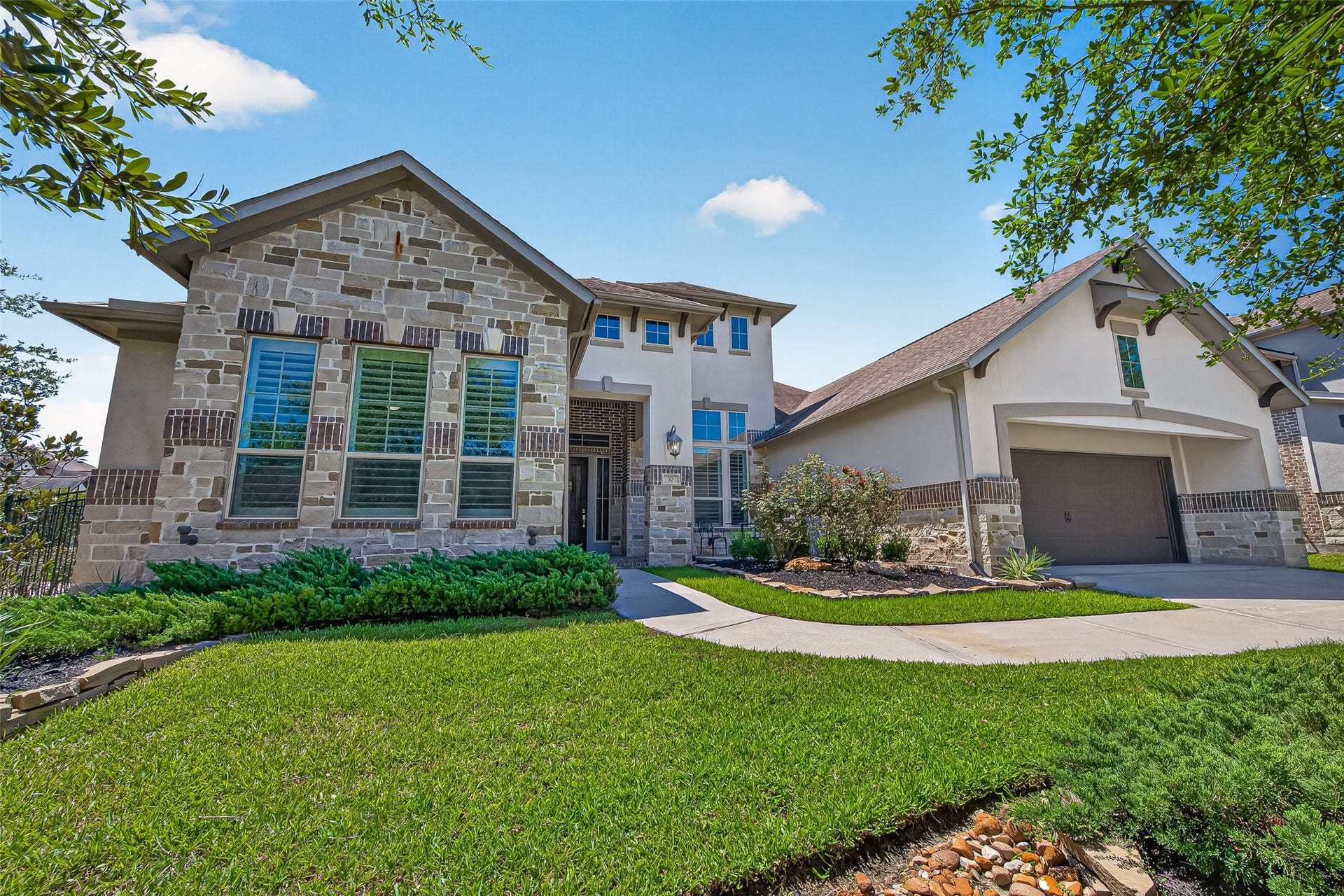 30 Argosy Bend Place, Tomball, TX 77375 Located on the corner, only one side neighbor. Beautiful stone, brick and stucco exterior.