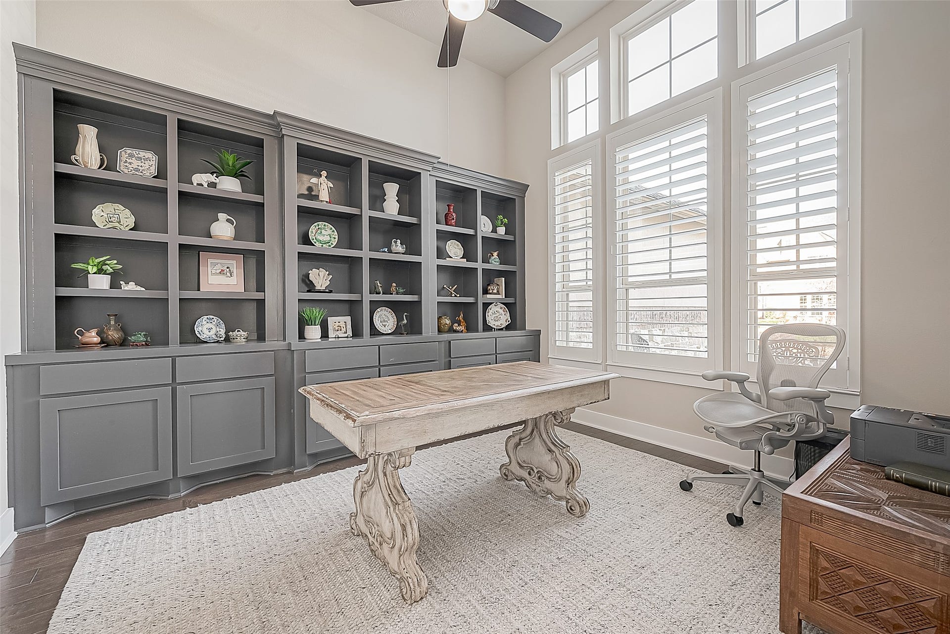 30 Argosy Bend Place, Tomball, TX 77375 The front-facing study has beautiful custom cabinetry with ample storage, a ceiling fan and Plantation shutters
