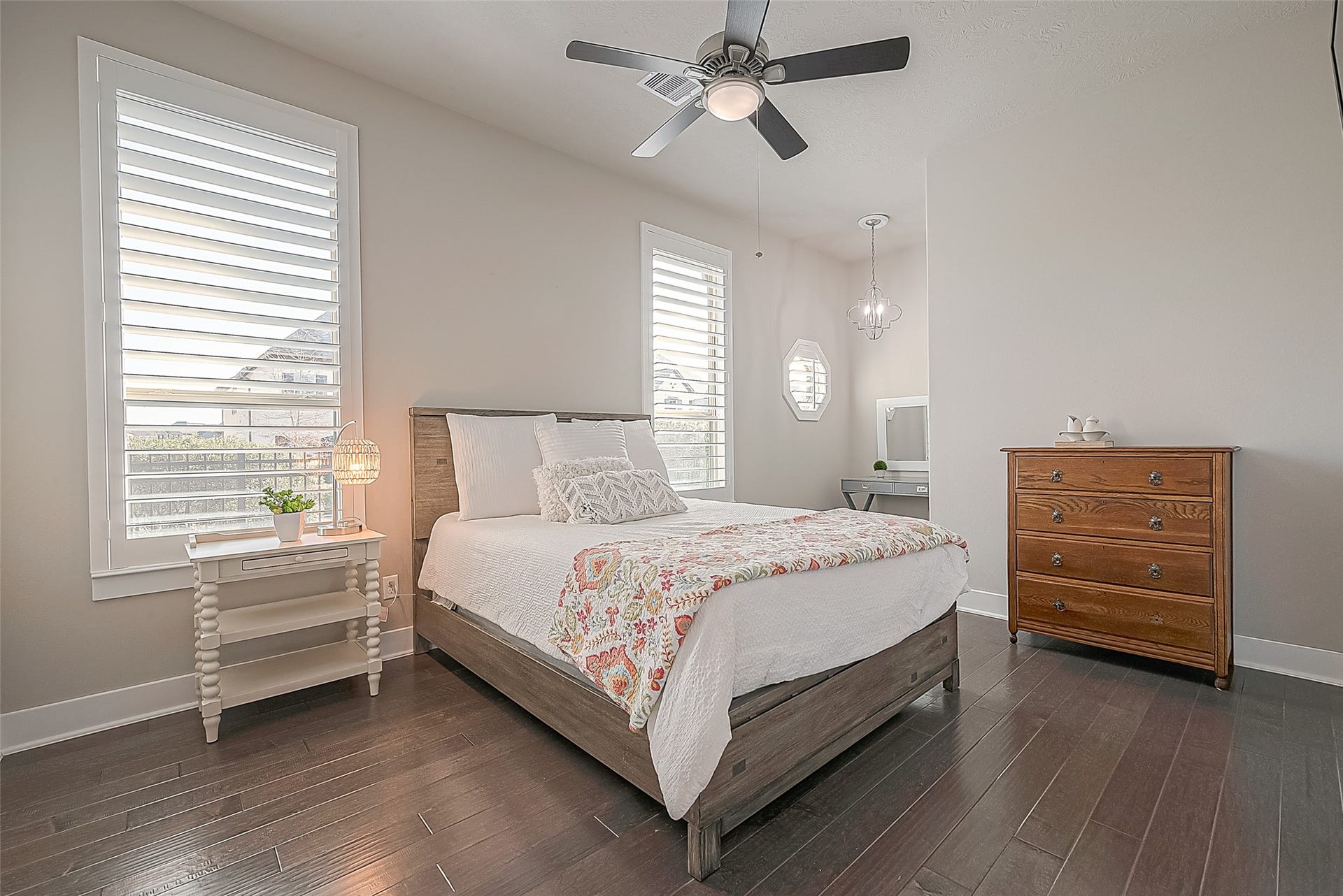 30 Argosy Bend Place, Tomball, TX 77375 Alternate view of the secondary bedroom side-facing the street. It has wood flooring, ceiling fan, walk-in closet and a cubby for furniture.