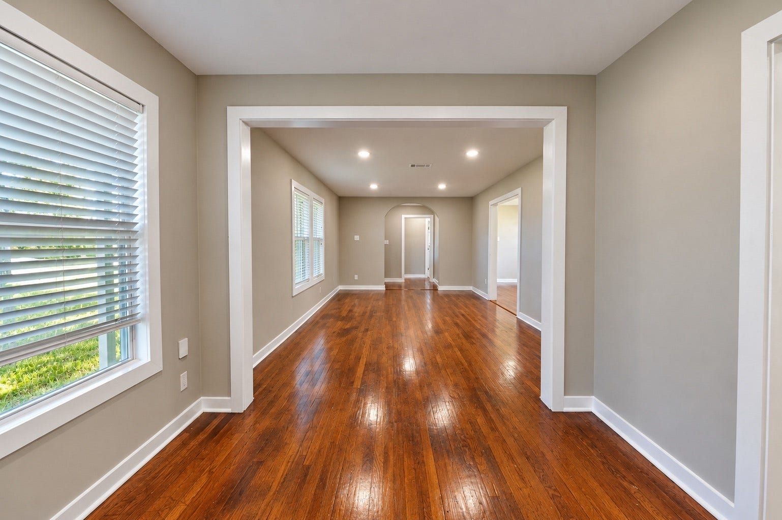 1837 Wycliffe Drive, Houston, TX 77043 Bright, open living space with gleaming hardwood floors and large windows that invite natural light.