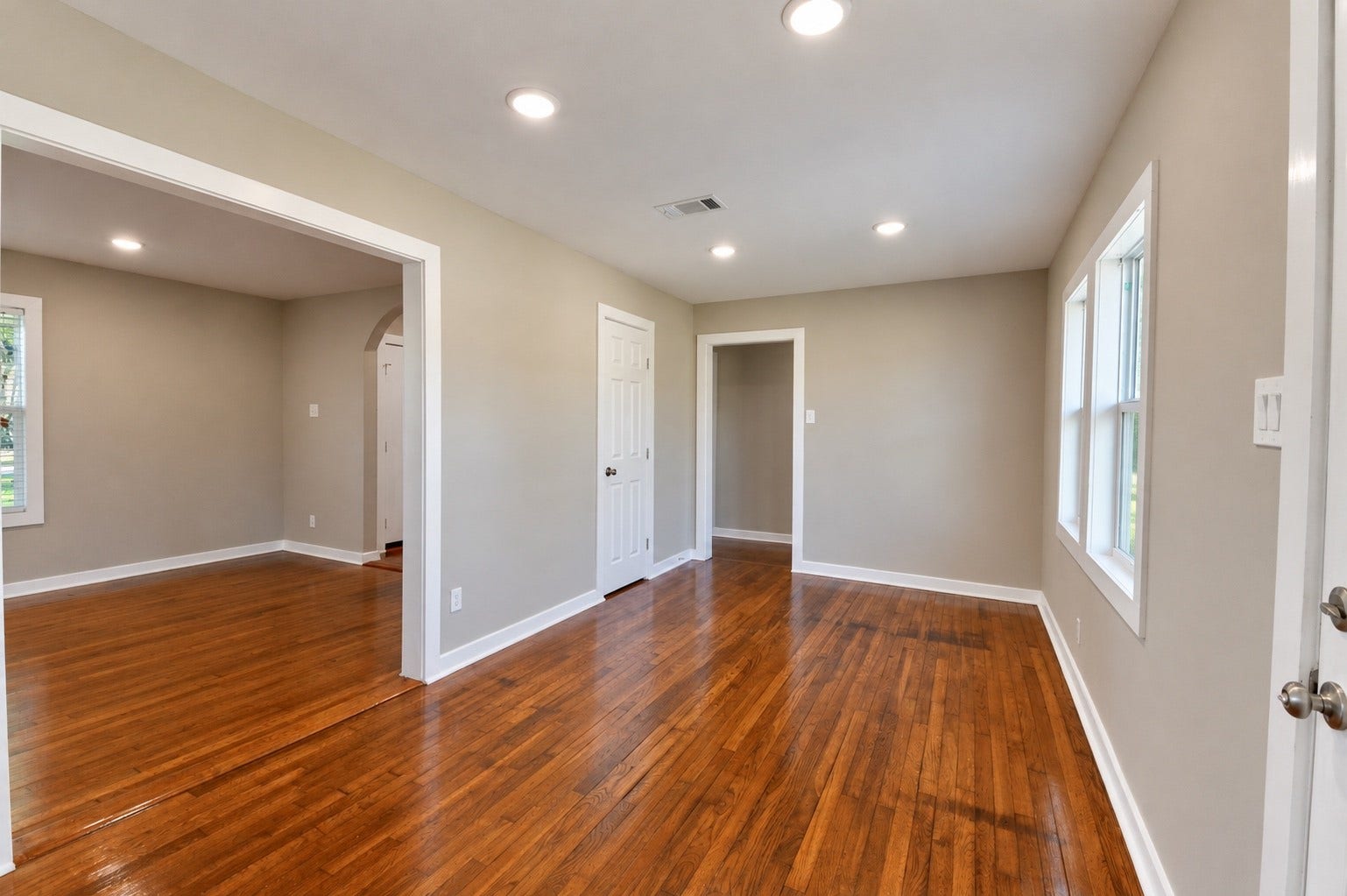 1837 Wycliffe Drive, Houston, TX 77043 Bright and inviting living area with gleaming hardwood floors, recessed lighting, and neutral walls, creating a warm and welcoming atmosphere.