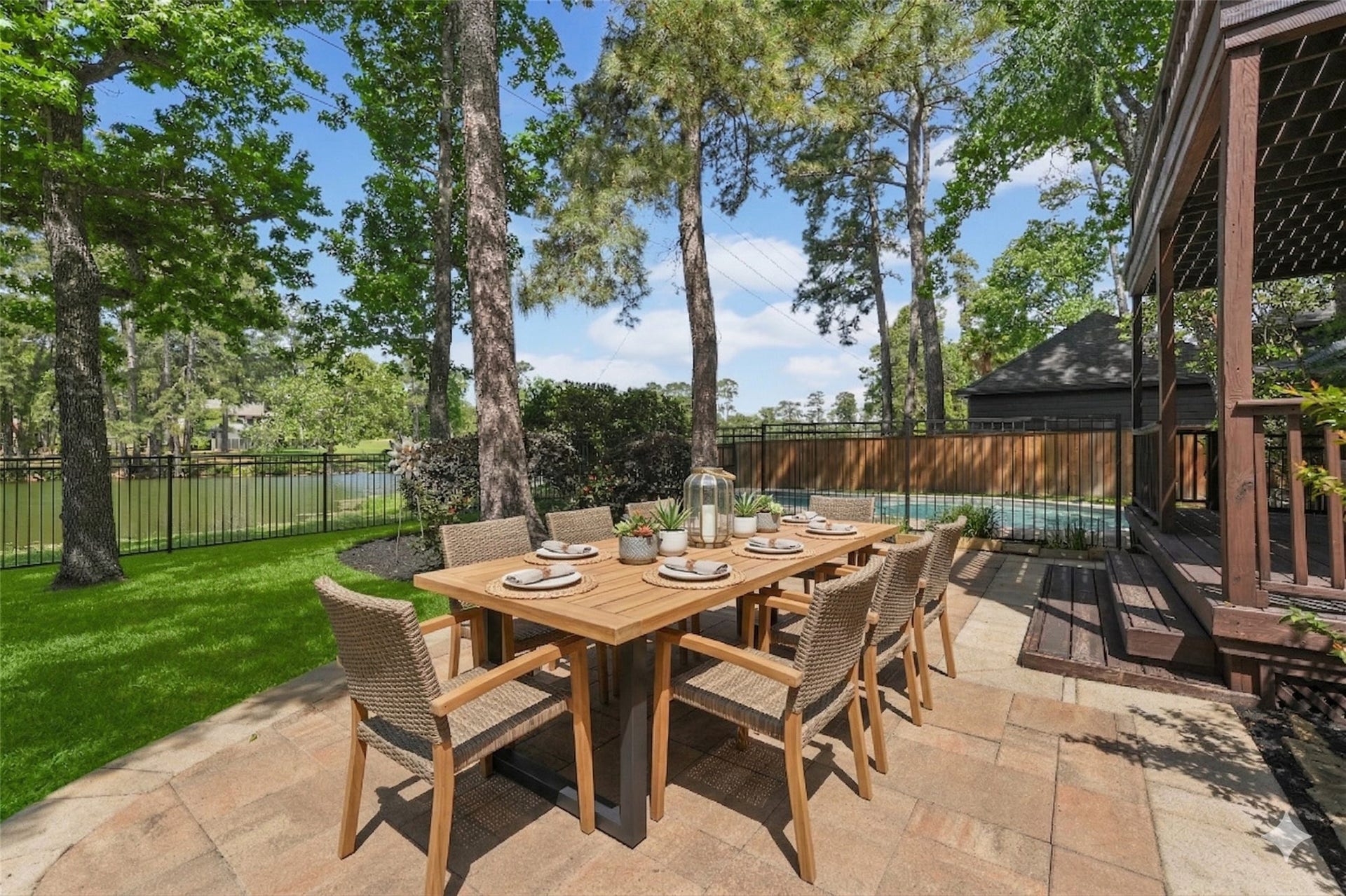 2023 Forest Garden Drive, Kingwood, TX 77345 Spacious backyard with a pool and green space offering flexibility for gatherings, outdoor living and enjoying the Kingwood lifestyle.