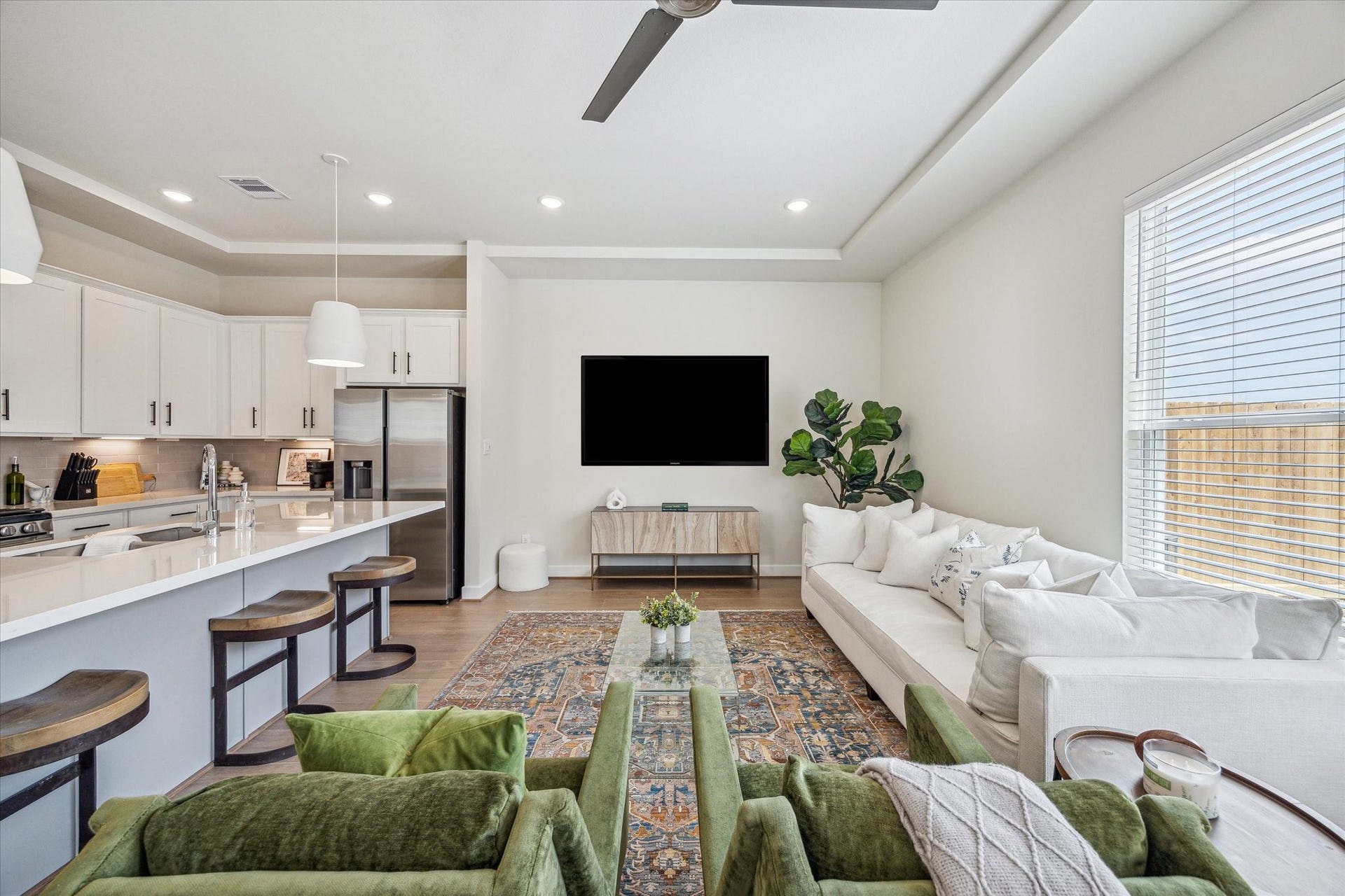 24405 Colonial Mound Drive, Katy, TX 77493 Representative photo showing the communitys model home living room. Layout and selections may vary.