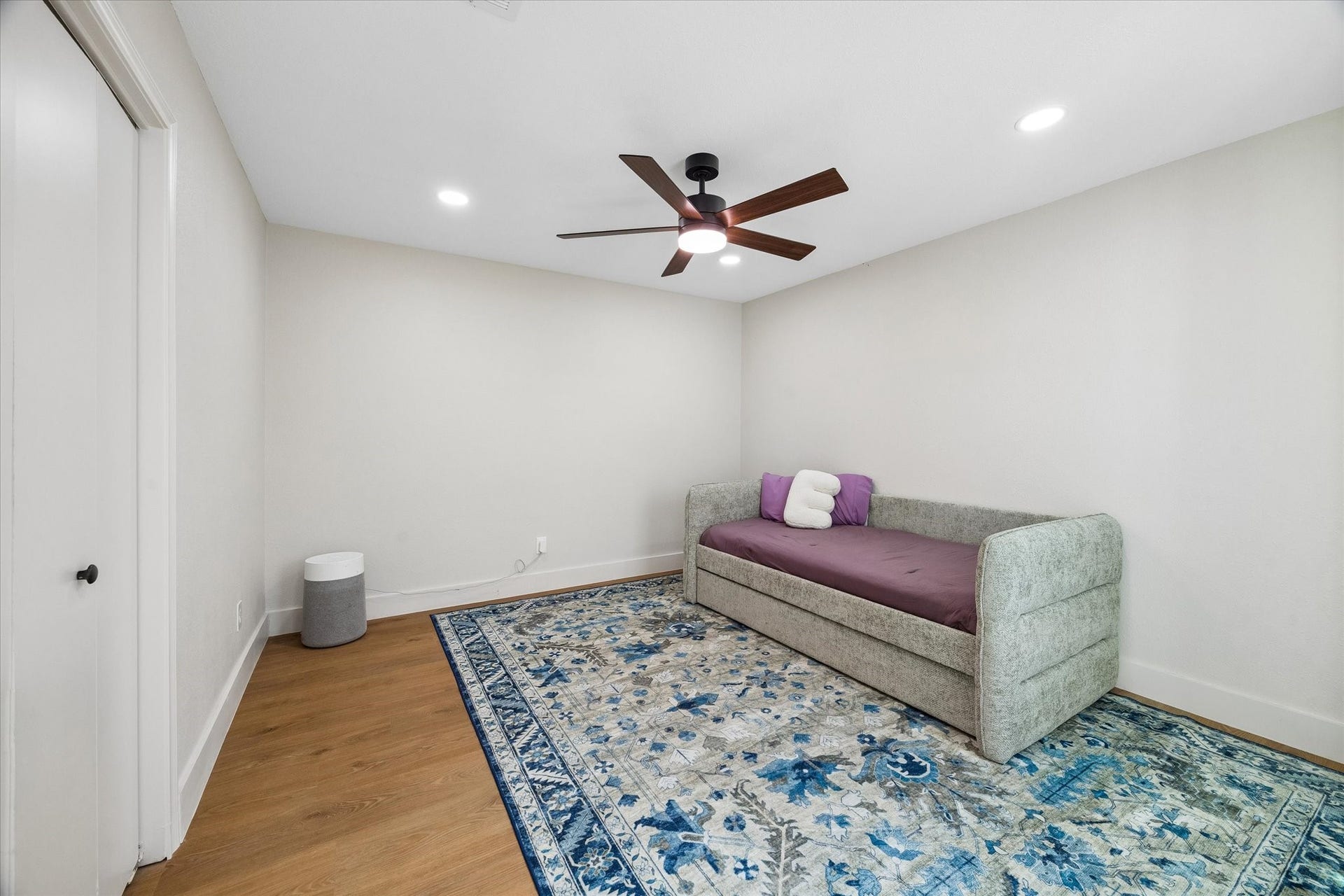 2302 Ashford Hollow Lane, Houston, TX 77077 This cozy secondary bedroom with a modern ceiling fan is the perfect place for relaxation or a guest retreat.