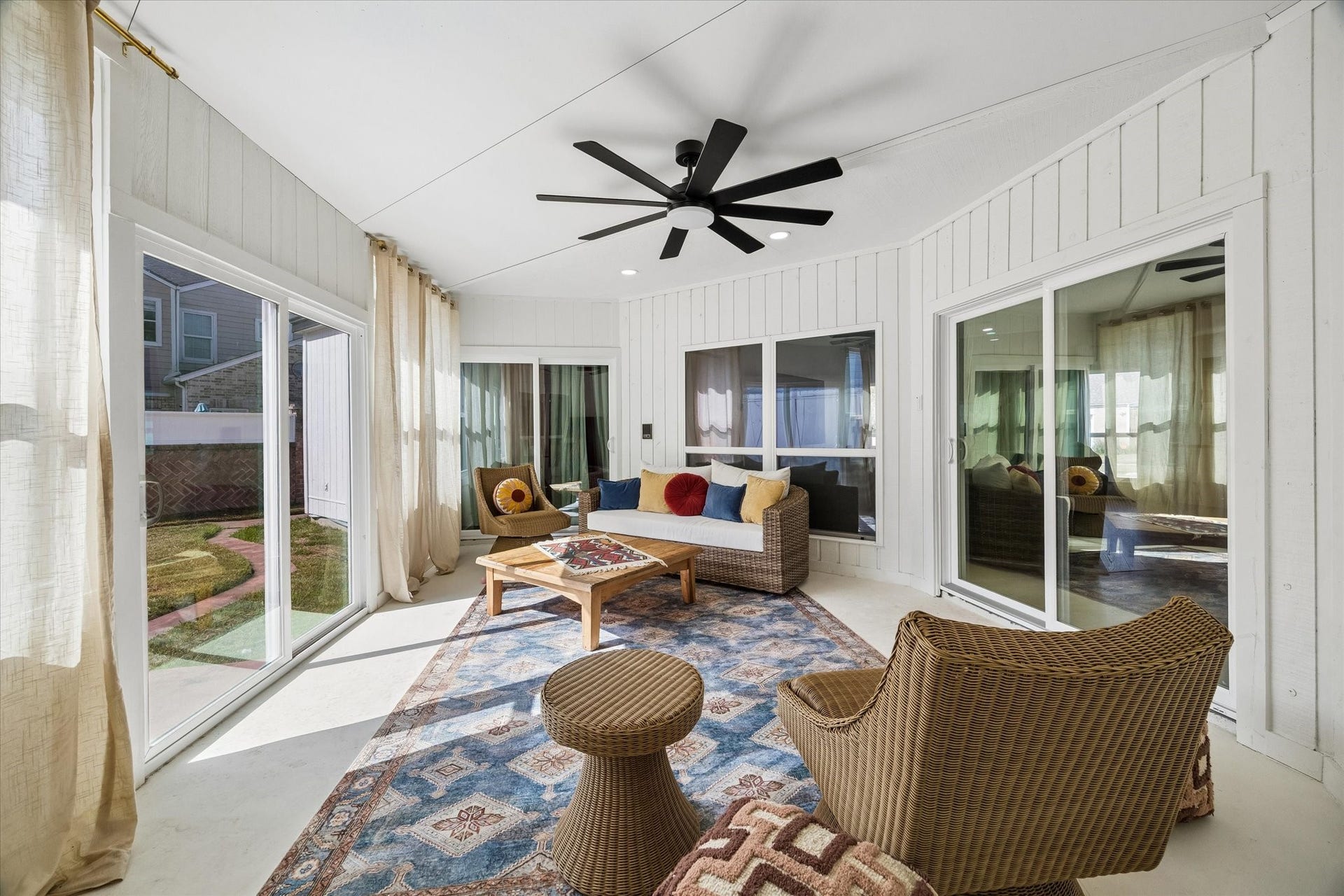2302 Ashford Hollow Lane, Houston, TX 77077 Bright and inviting enclosed sunroom featuring large windows, a stylish ceiling fan is perfect for relaxing and enjoying the view.
