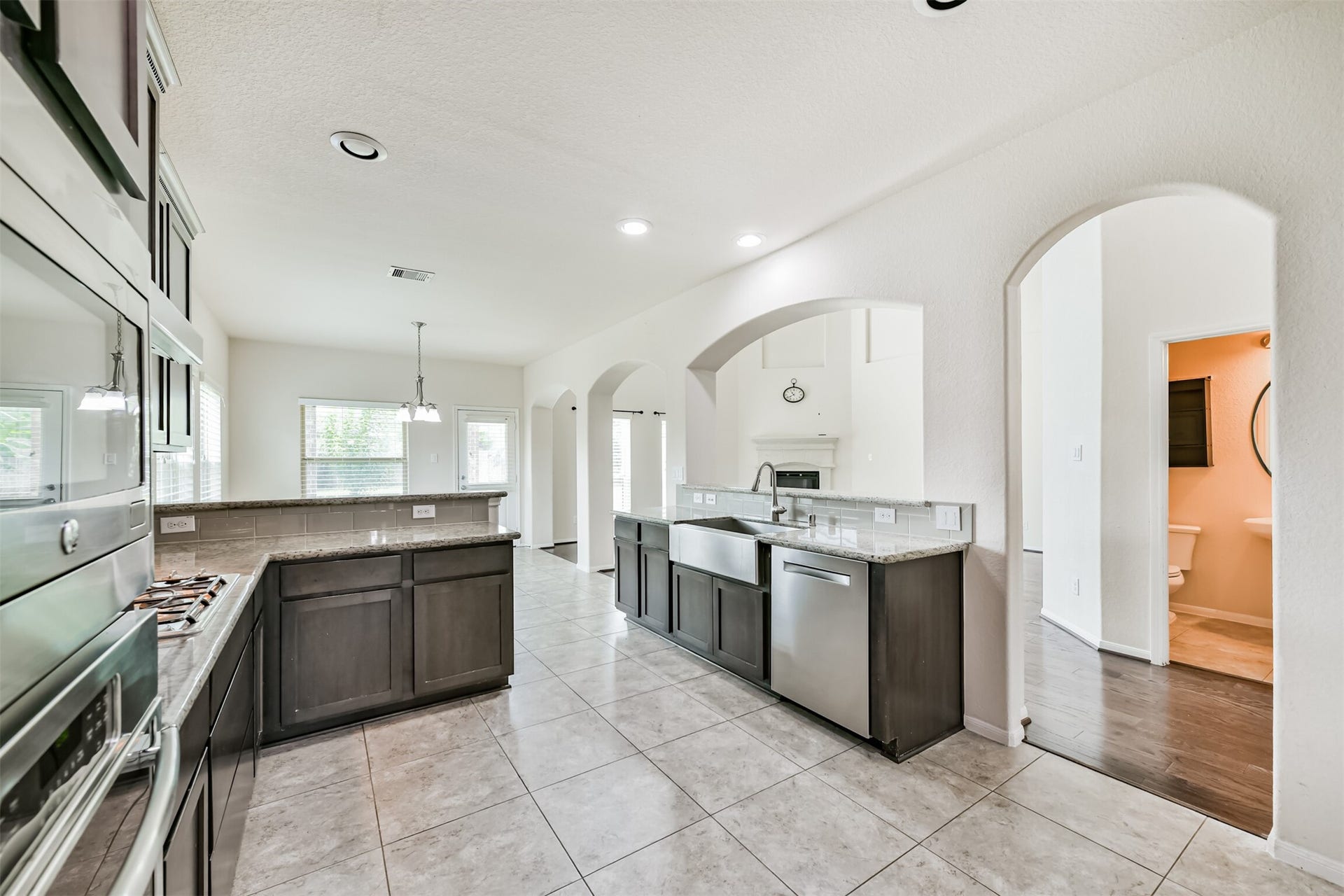 2811 Afton Drive, Pearland, TX 77581 Spacious kitchen featuring modern appliances, elegant cabinetry, and a sleek open layoutideal for cooking and entertaining.