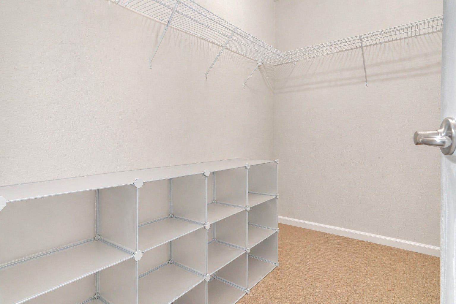 21211 Arcadia Park Lane, Humble, TX 77338 Large walk-in closet providing ample storage with built-in shelving and hanging space. Designed for organization and convenience, this closet easily accommodates a full wardrobe and accessories. A functional and practical feature that enhances everyday living.