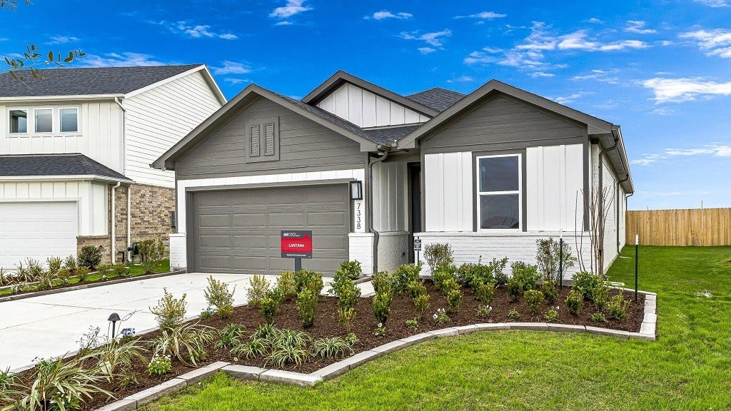 7338 Grand Mason Drive, Cypress, TX 77433 Modern facade is full of character and style by design with perfect mix of materials and colors.