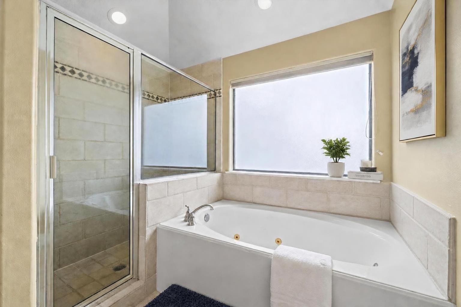 2604 Chenevert Street, Houston, TX 77004 The primary en suite has a full size soaking tub and wide separate shower - Virtually staged