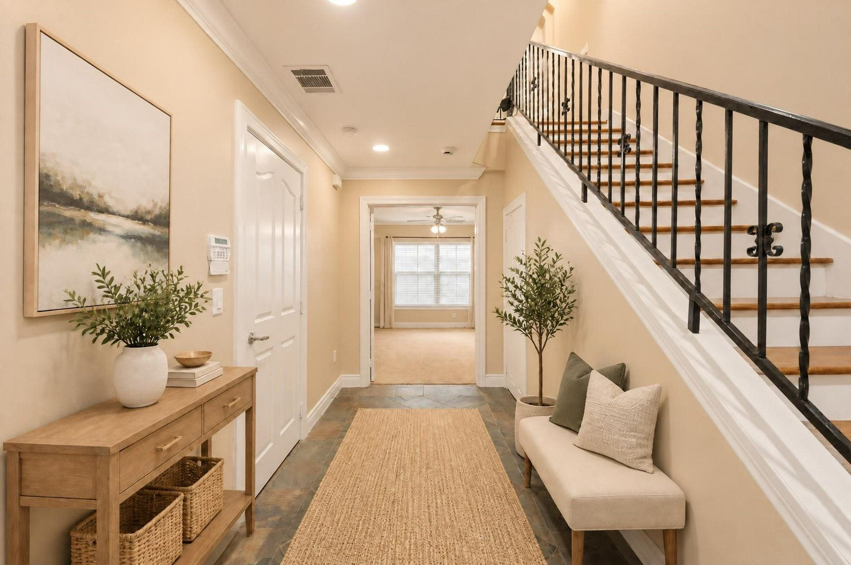 2604 Chenevert Street, Houston, TX 77004 The entrance splits leading to the first floor bedroom and stairs - Virtually staged