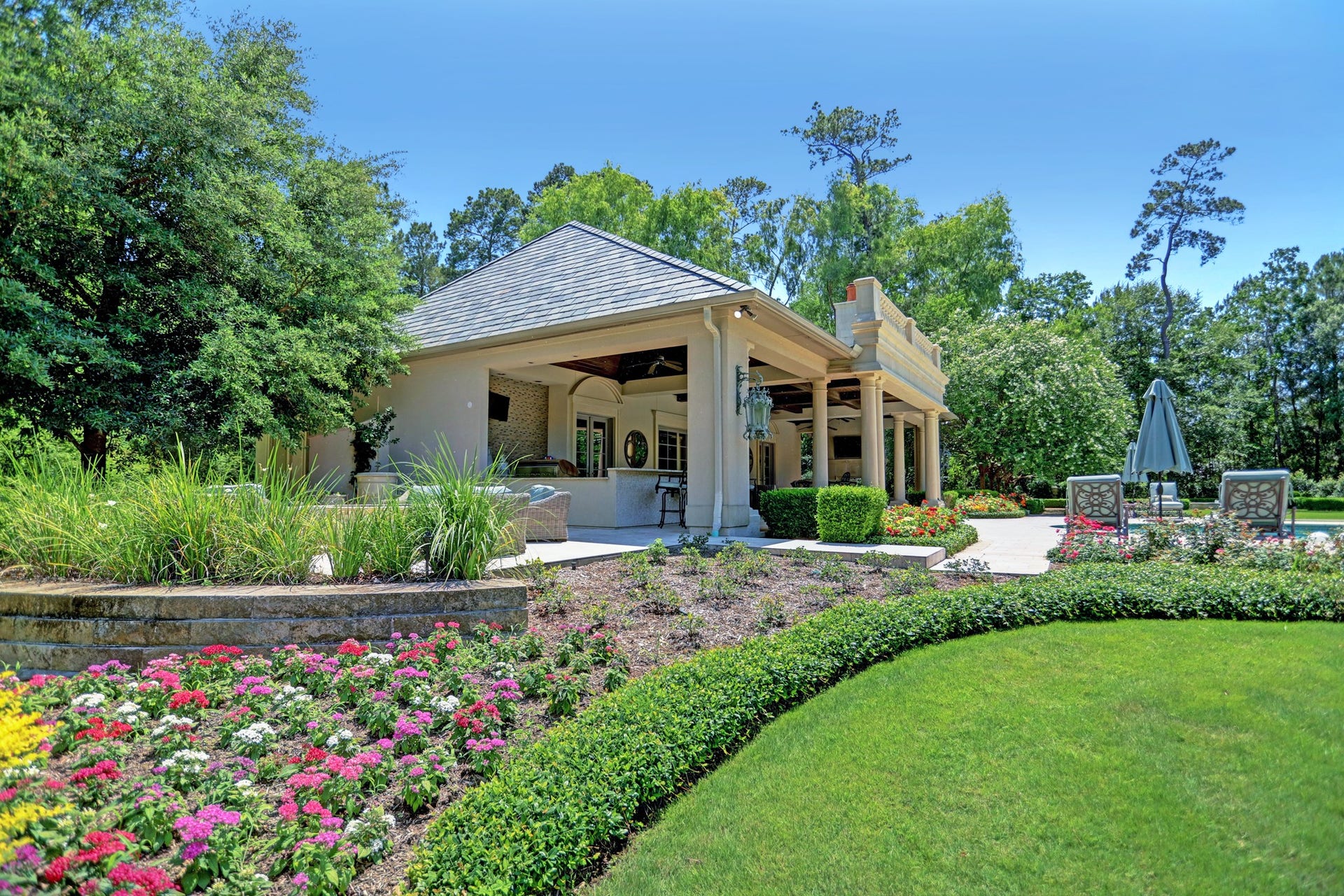 36 Saddlebrook Court, Tomball, TX 77375 Meticulously maintained and planned gardens wrap the entire estate with pathways to enjoy every type of planting you can dream of allowing for blooms throughout the year.