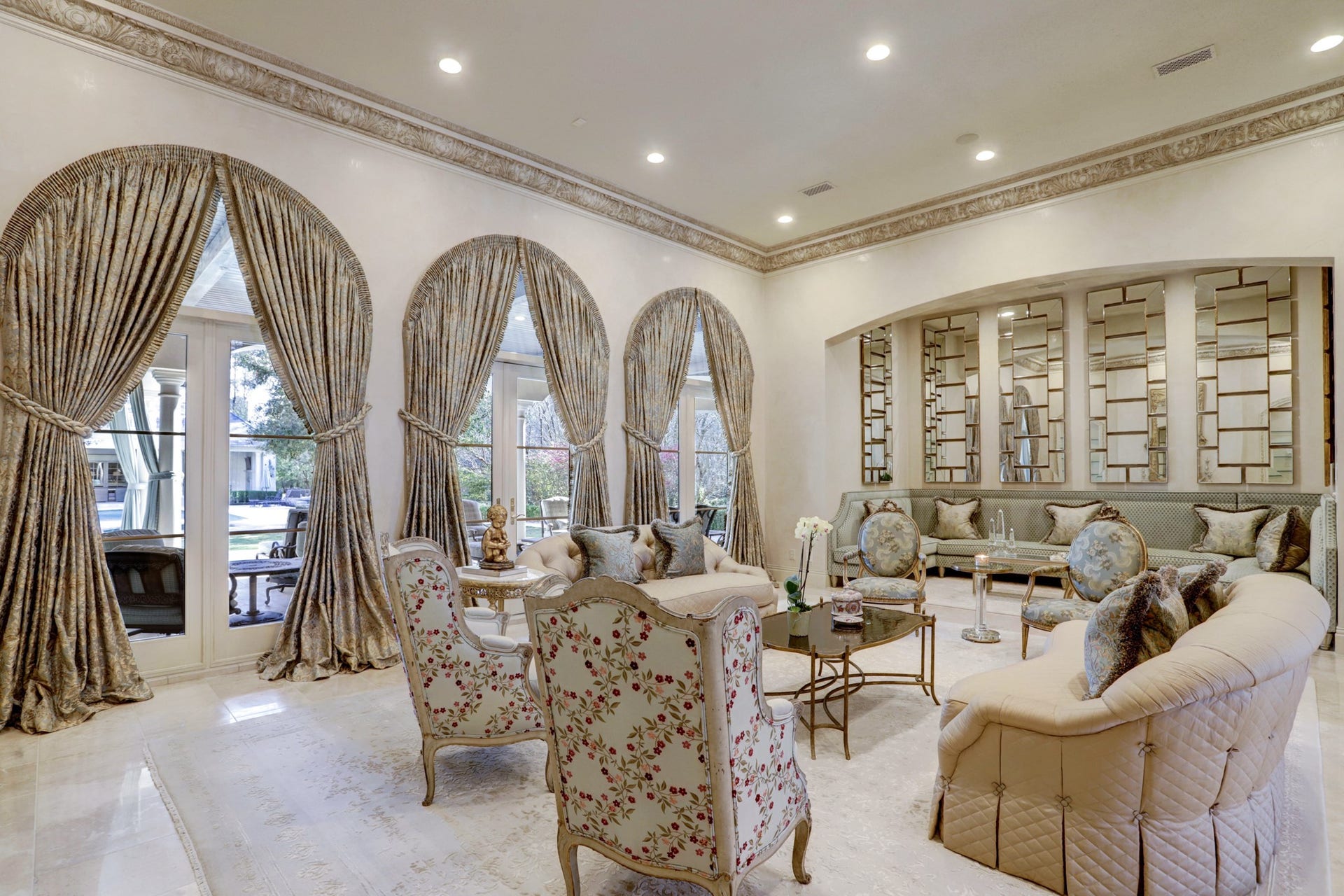 36 Saddlebrook Court, Tomball, TX 77375 Formal living room stuns at every angle. Walls of windows and doors to outdoor living while also adding natural light filling the space.