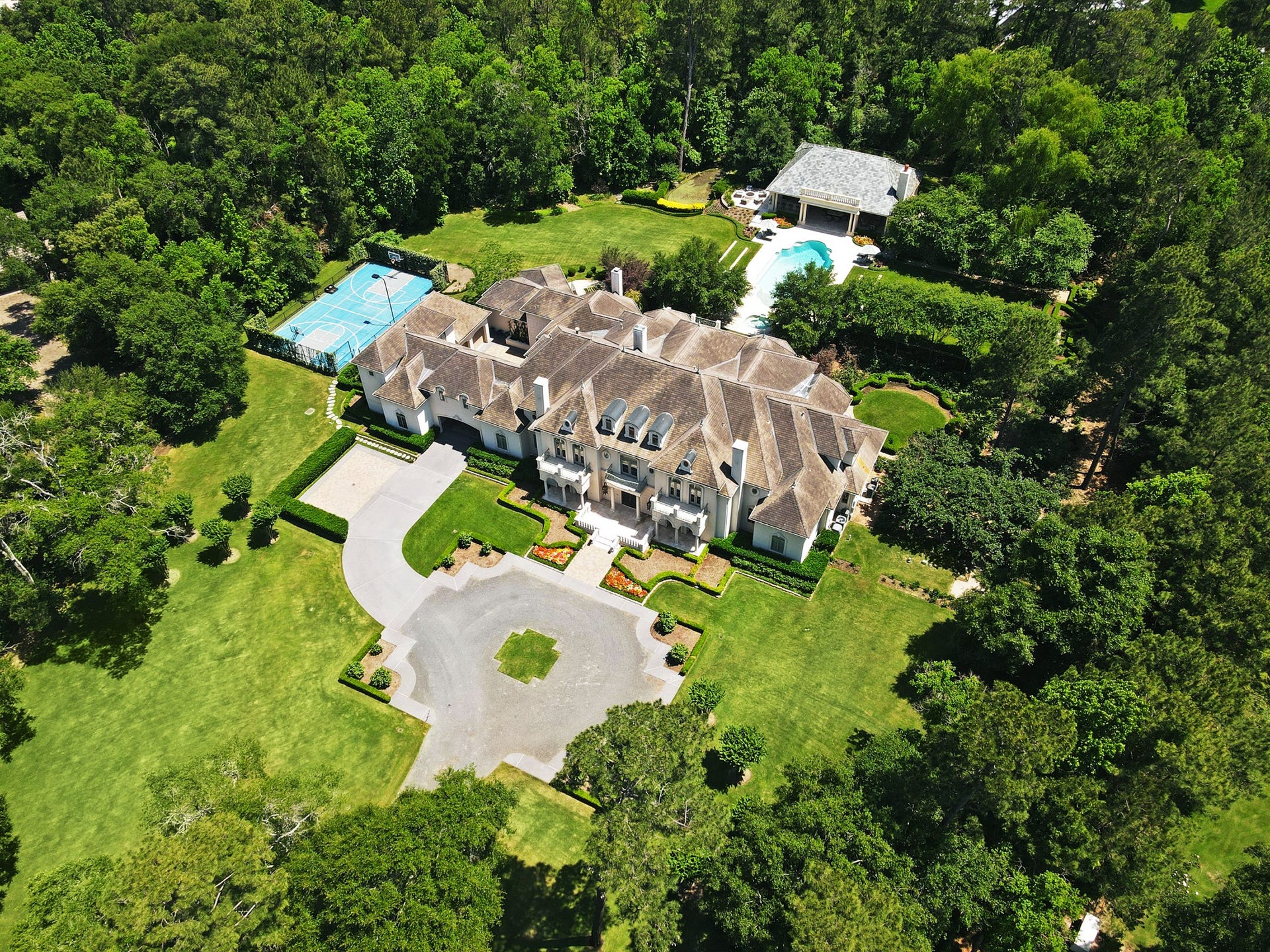 36 Saddlebrook Court, Tomball, TX 77375 Surrounded by forest this French estate on 6+ impeccably manicured acres in an exclusive, gated community.