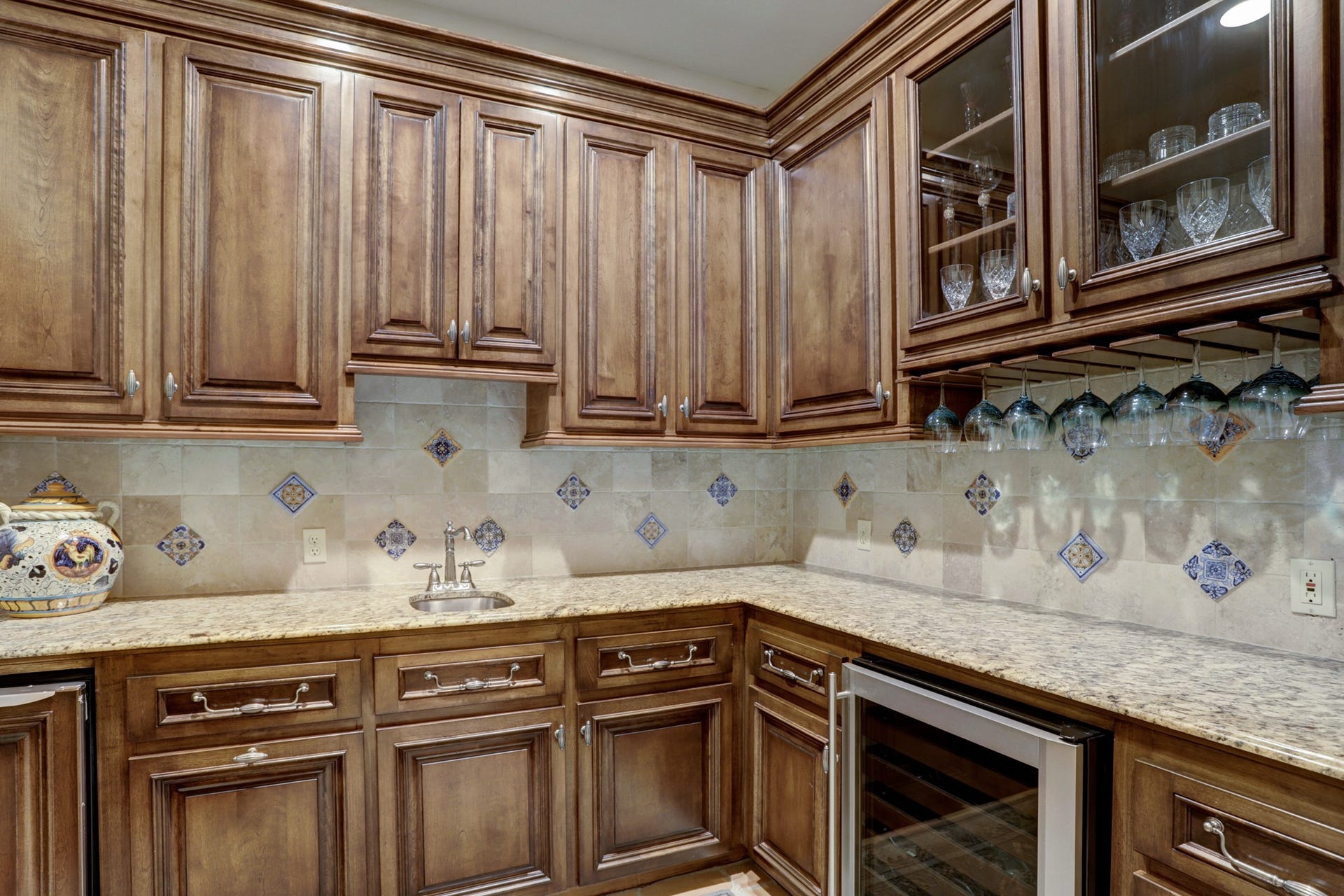 36 Saddlebrook Court, Tomball, TX 77375 Butlers pantry equipped with wet bar includes plenty of storage and wine chiller.