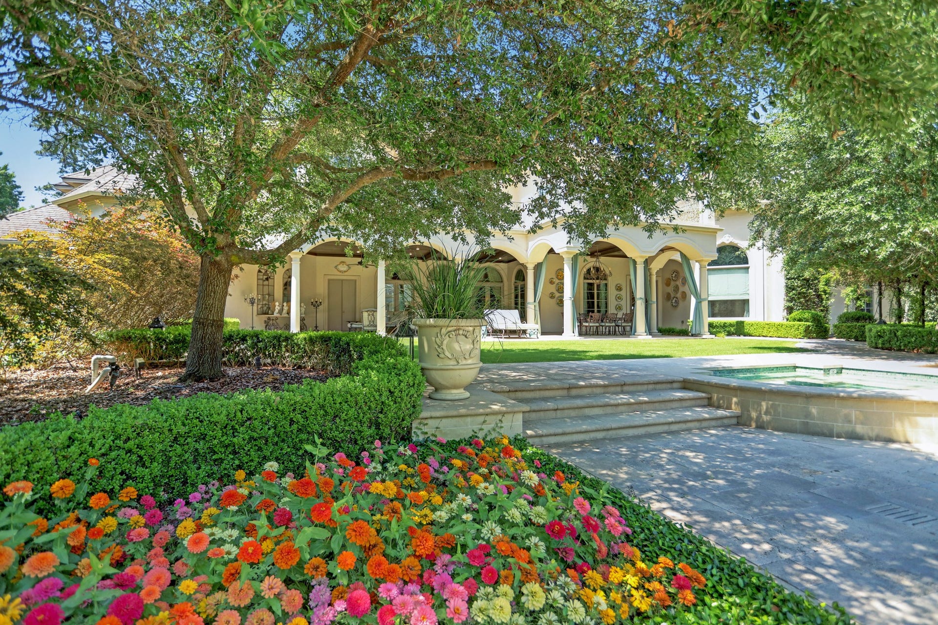 36 Saddlebrook Court, Tomball, TX 77375 Enjoy extensive covered outdoor living on the first floor of the main house, plus a private balcony above, embraced by majestic live oak trees that provide year-round shade.