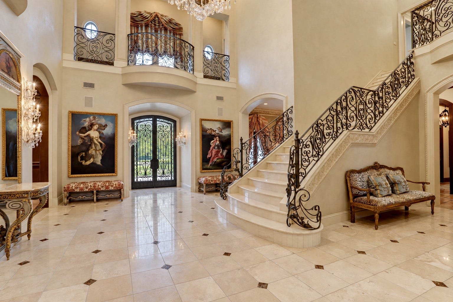 36 Saddlebrook Court, Tomball, TX 77375 Grand foyer with soaring ceilings, extensive marble floors and staircase, and a stunning iron stair rail adorned with intricate details and plaster walls welcome you into this estate.