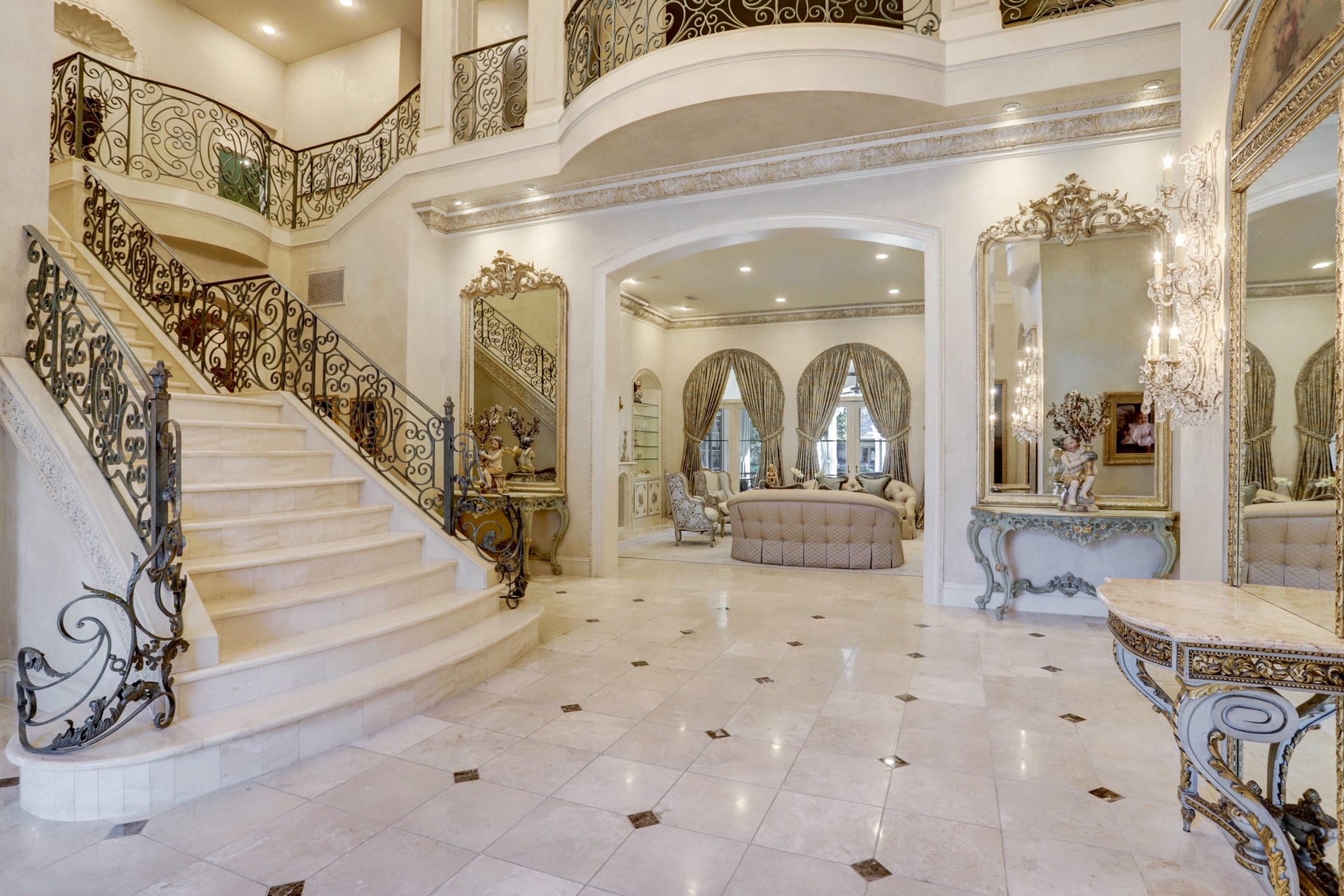36 Saddlebrook Court, Tomball, TX 77375 A seamless transitions into the formal living area, which incorporates luxurious materials, intricate detailing, and an overall sense of grandeur.