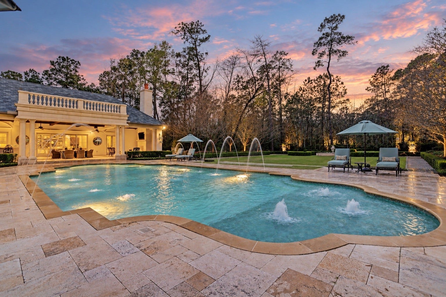 36 Saddlebrook Court, Tomball, TX 77375 Take a plunge into the 10-foot deep end of the pool, surrounded by lush greenery and vibrant blooming gardens, offering a serene escape from the summer heat, with the pool house gracefully overlooking the scene.