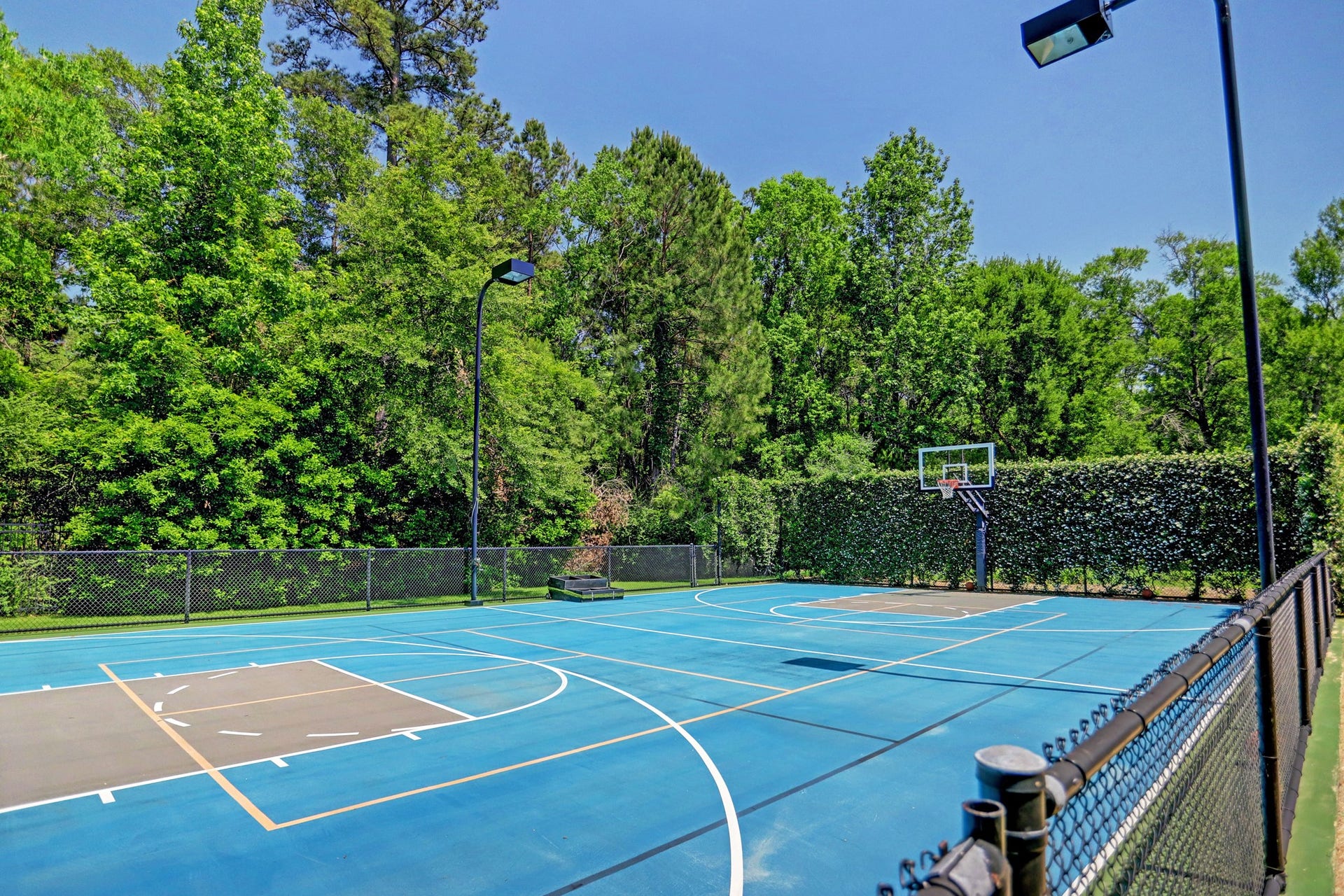 36 Saddlebrook Court, Tomball, TX 77375 Make the most of the exceptional amenities with a private multi-use sports court on the premises.