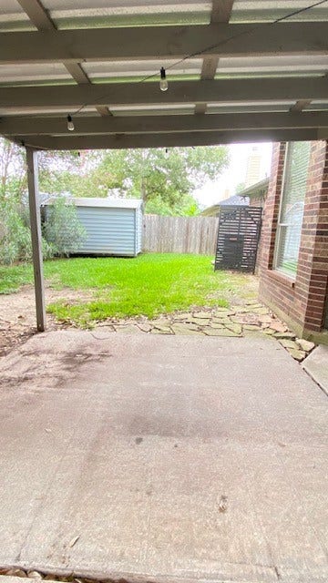 2216 Westminister Street, Pearland, TX 77581 Covered patio and storage for yard supplies