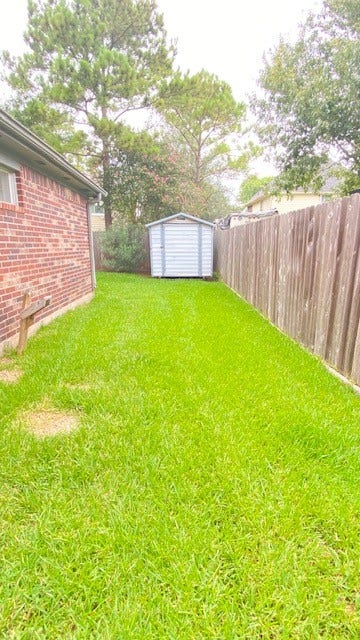 2216 Westminister Street, Pearland, TX 77581 Side yard with view of Storage bldg