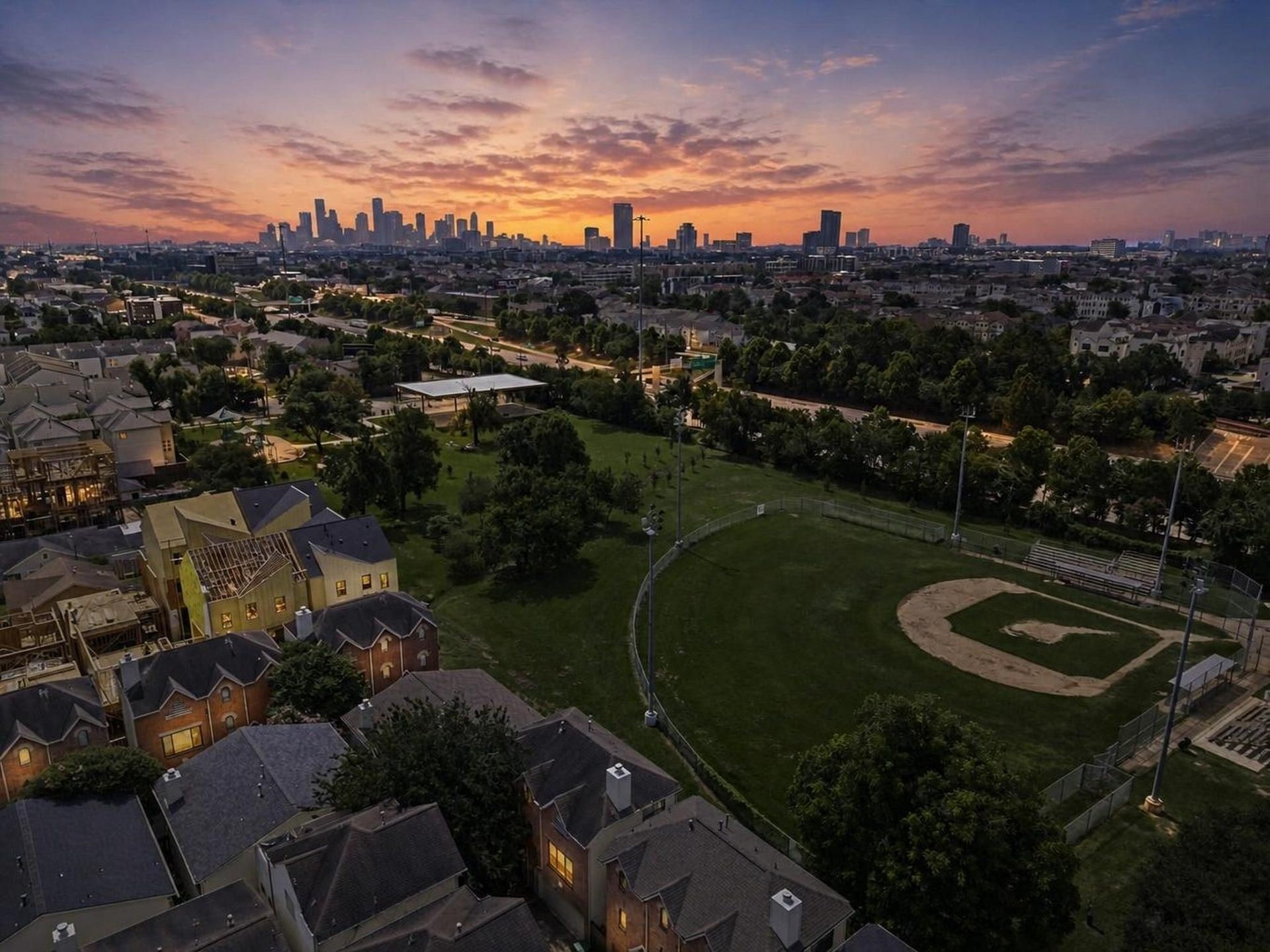 2154 Arabelle Street, Houston, TX 77007 The aerial view captures the homes Cottage Grove setting with the Houston skyline in the distance. It tells the story of a private residential pocket connected closely to the energy of the city.