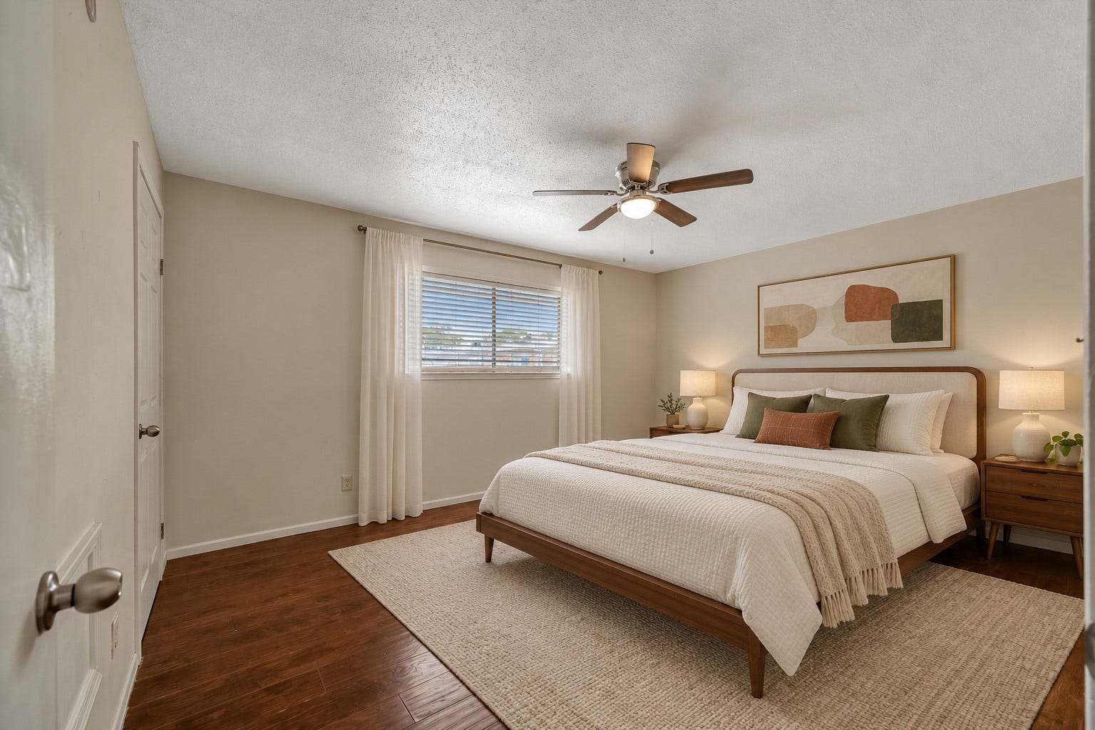 This spacious bedroom overlooks the community parking area, offering practicality and convenience. Virtually staged.