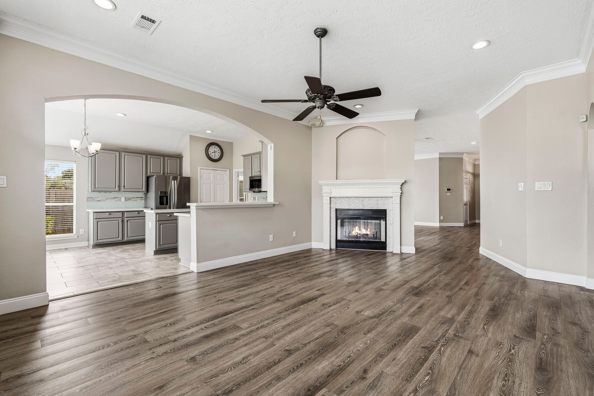 Enjoy the flexibility of two spacious living areas connected by a double-sided fireplace.
