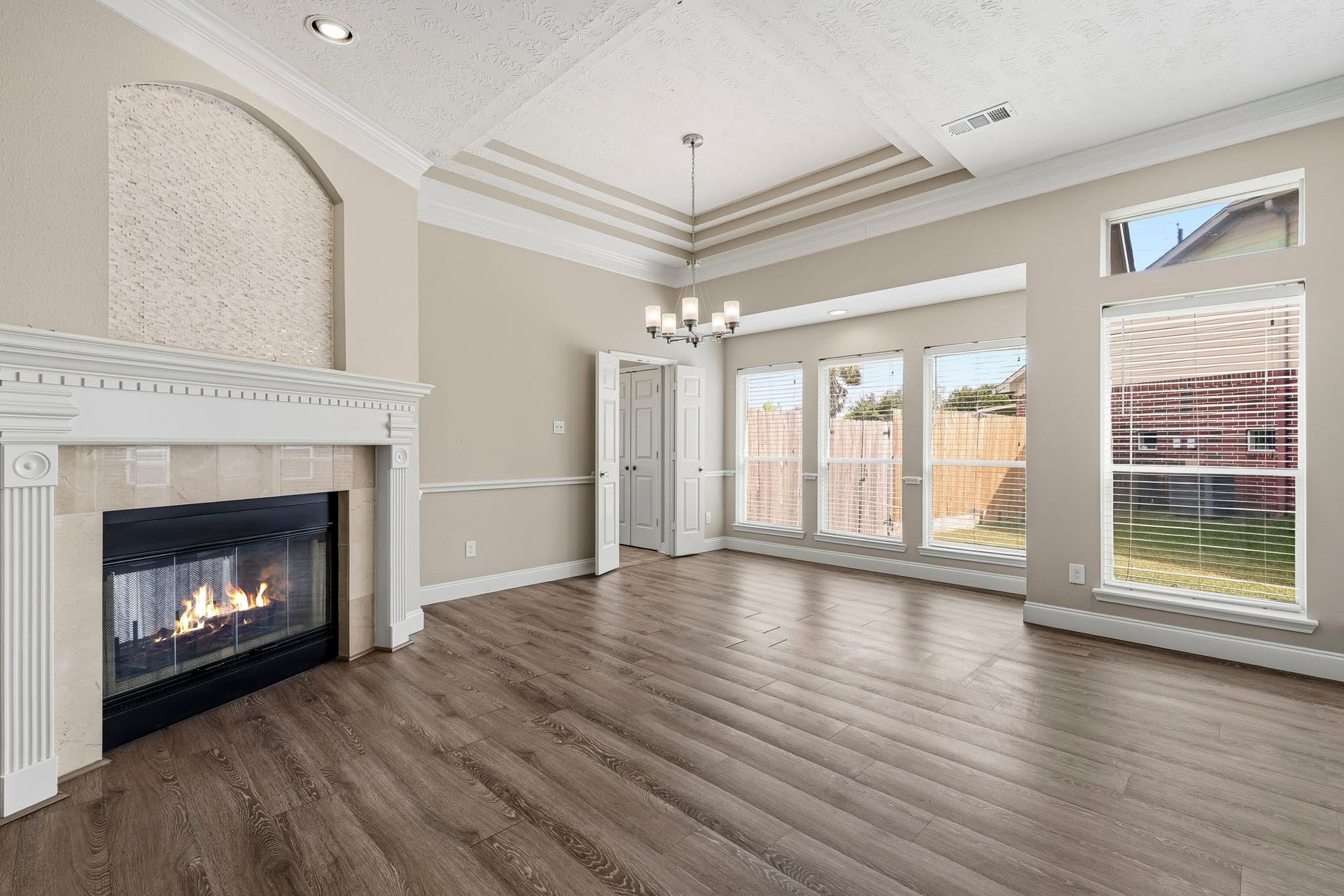 A beautiful double-sided gas-log fireplace adds warmth and character to both living areas.