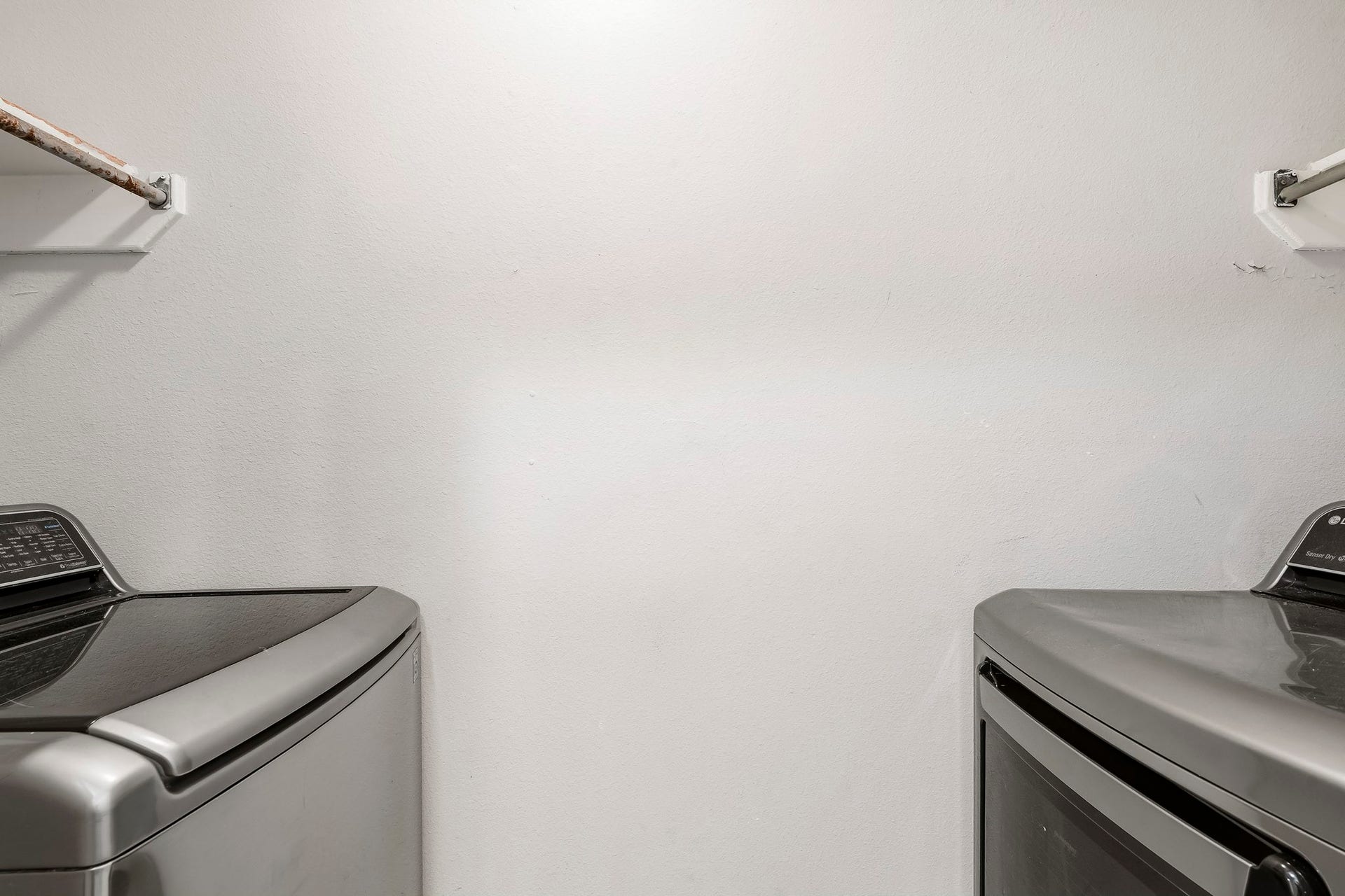 Convenient indoor utility room with washer and dryer included.