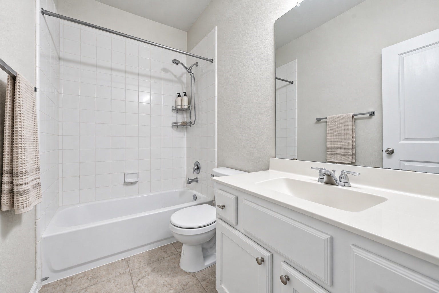 This convenient downstairs full bathroom features a clean, functional layout with a tub and shower combination, vanity storage, and neutral finishes!
*virtually staged*