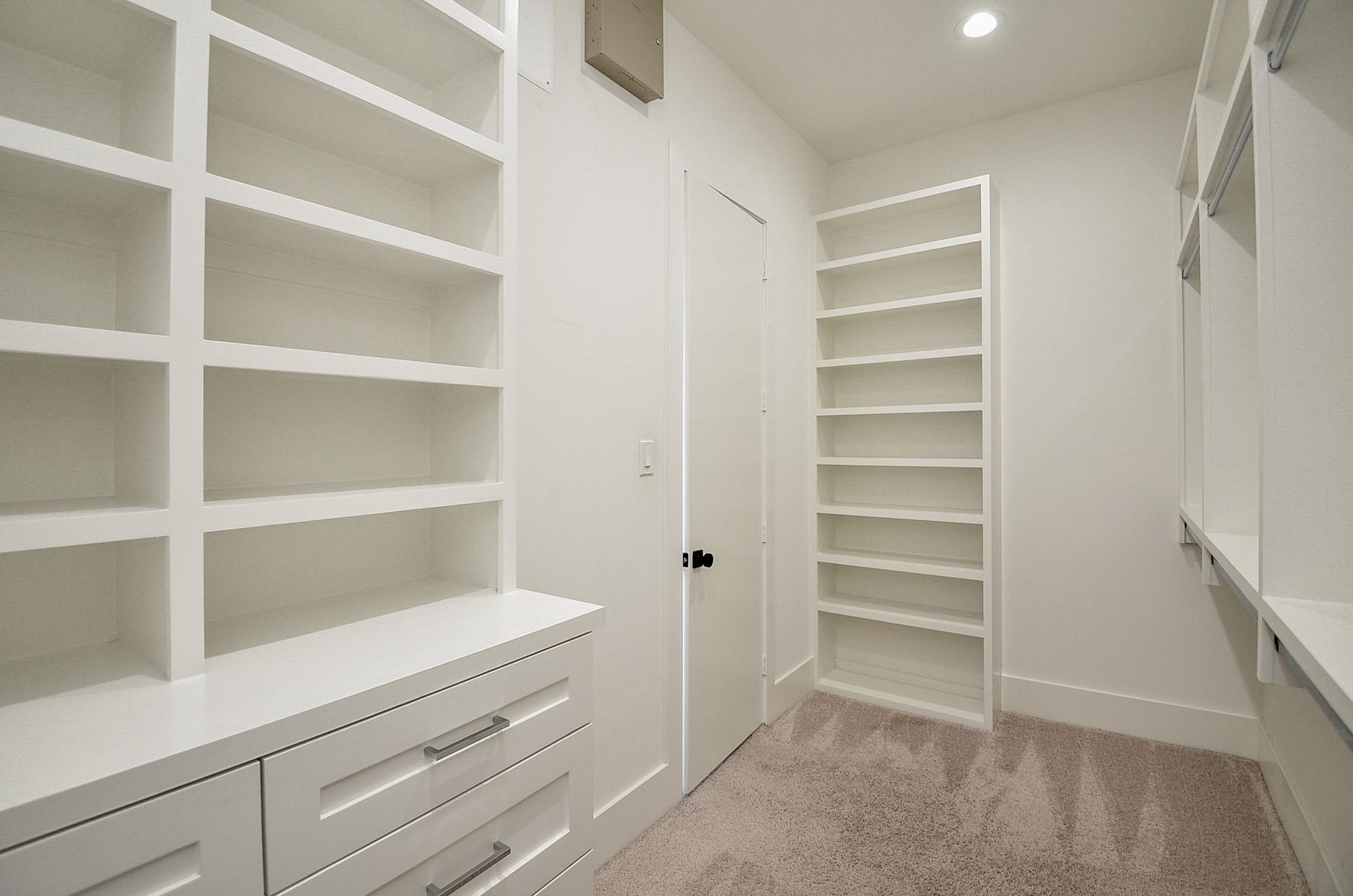 204 Burr Street, #G, Houston, TX 77011 Primary walk-in closet with built-in drawers, shelving, and hanging storage.