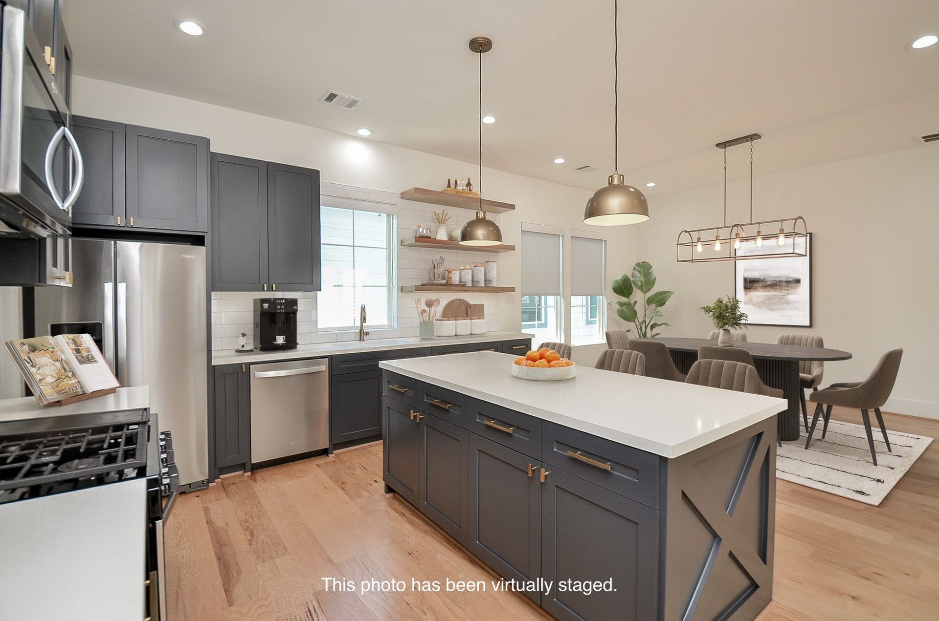 204 Burr Street, #G, Houston, TX 77011 Kitchen storage combines cabinetry, open shelving, and an adjacent walk-in pantry.