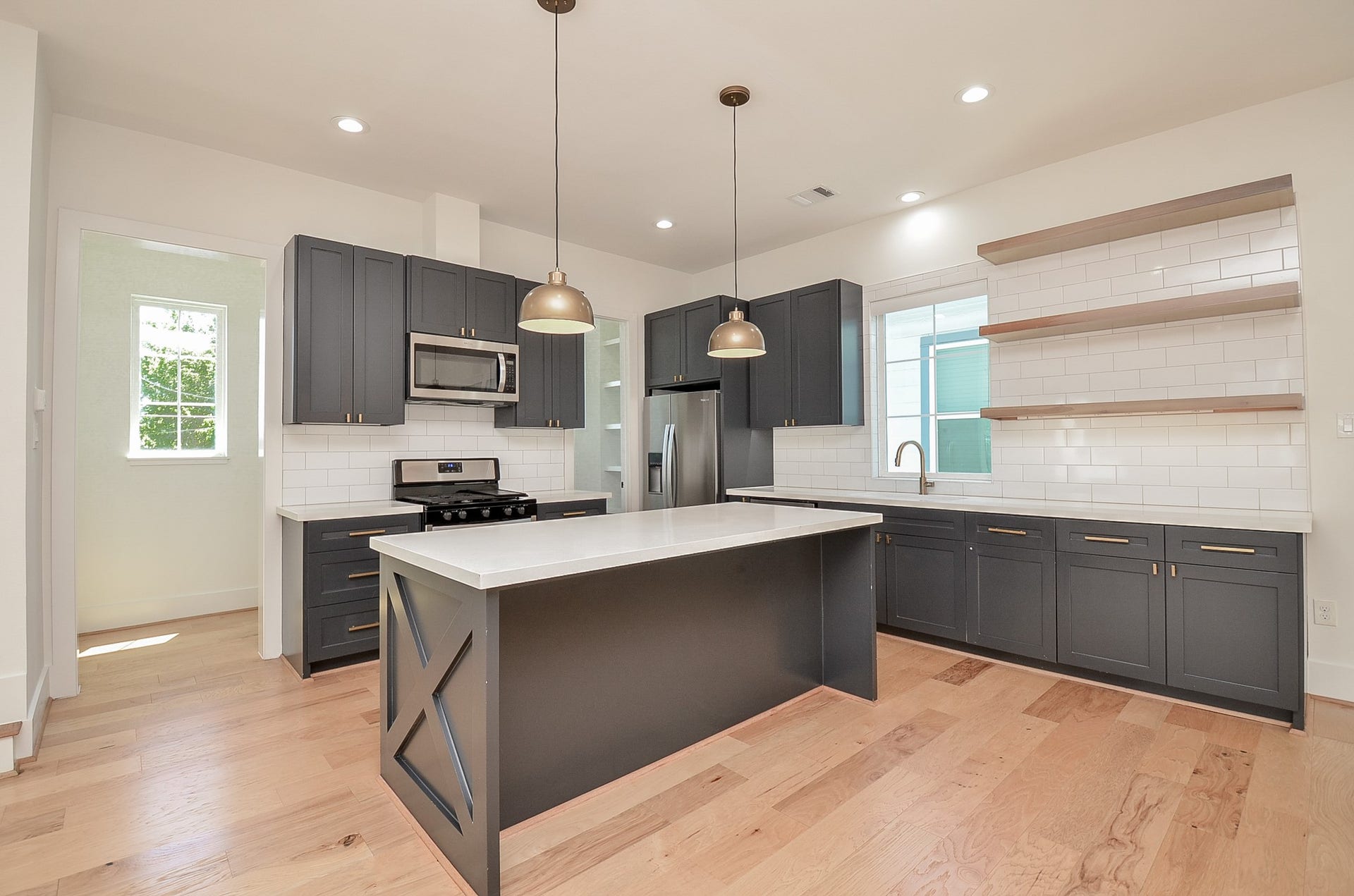 204 Burr Street, #G, Houston, TX 77011 The large island has space for bar stools and there's plenty of cabinetry for your storage needs.