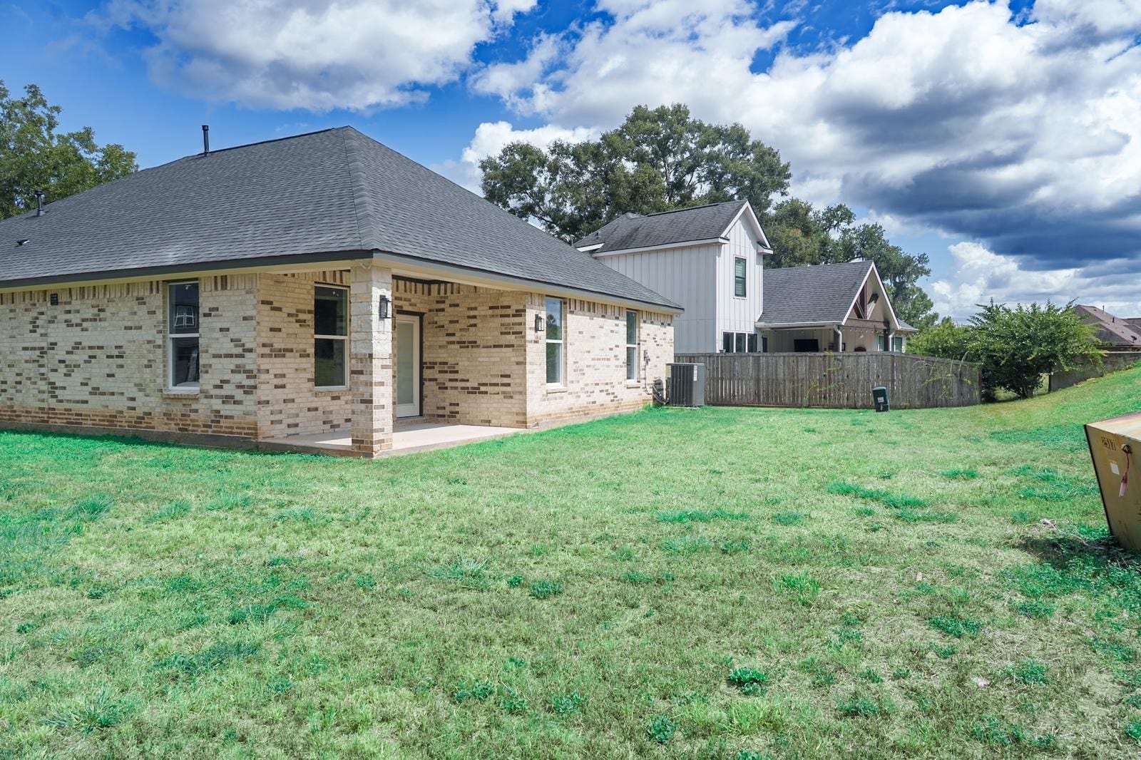 2306 Ridgewood Drive Drive, West Columbia, TX 77486 Charming brick home with a spacious backyard, perfect for outdoor activities and entertaining.