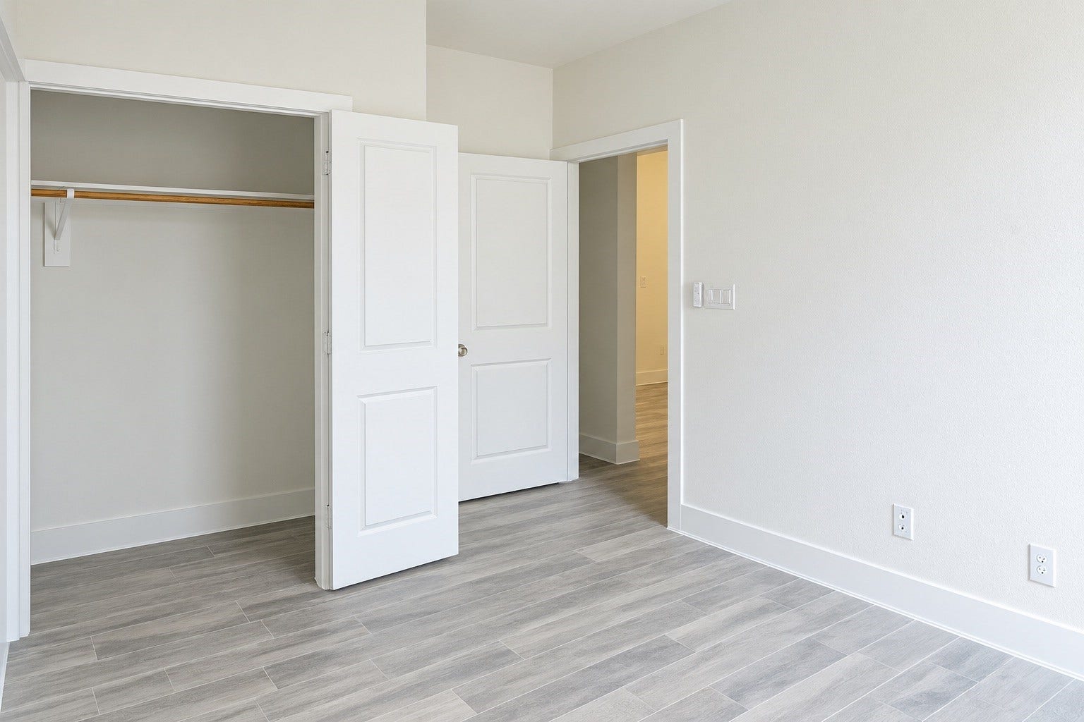 2306 Ridgewood Drive Drive, West Columbia, TX 77486 Bright and airy room featuring a spacious closet and sleek wood-look tile flooring, perfect for creating a comfortable living space.