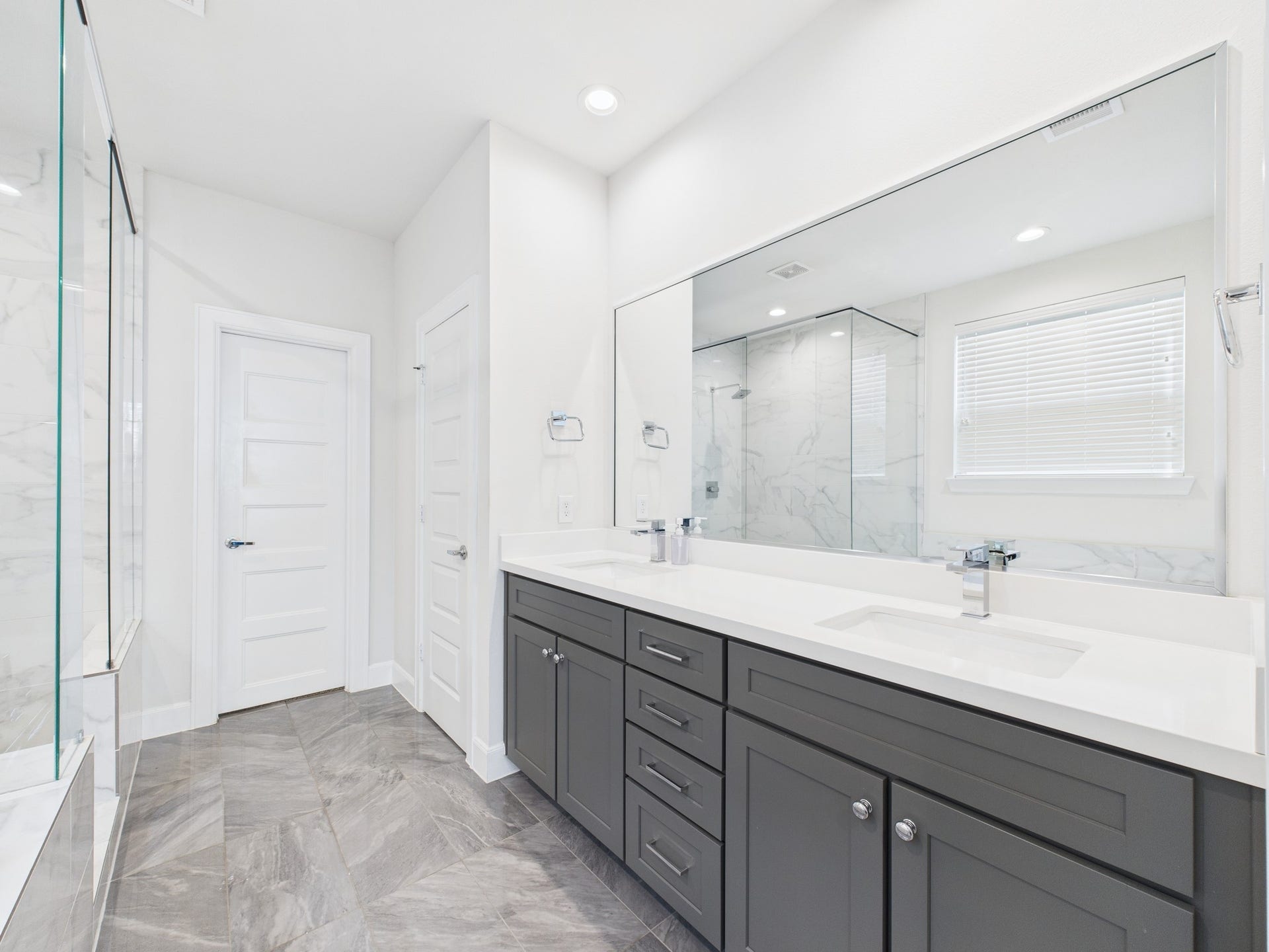 Double sink with lots of counter space and cabinet