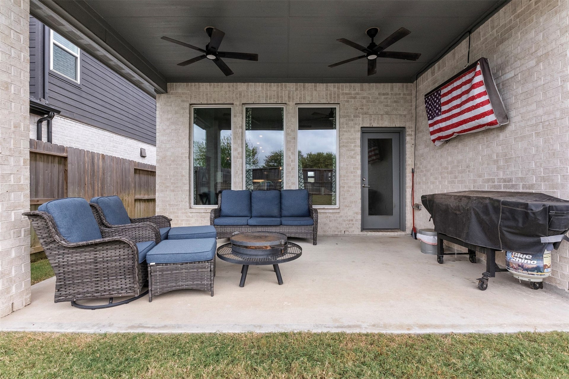 22107 Palo Dura Lane, Tomball, TX 77375 Morning coffee, weekend cookouts and evenings around the fire pit all happen here, on the extended covered patio with ceiling fans to keep things comfortable.