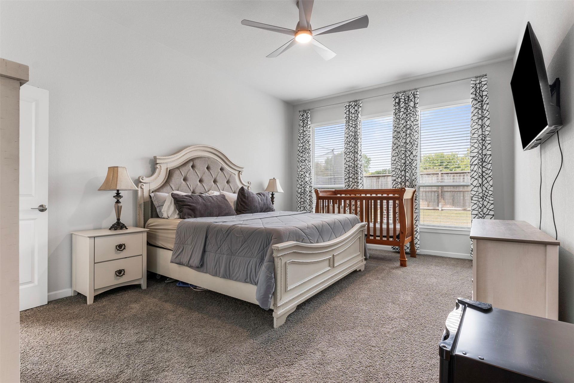 22107 Palo Dura Lane, Tomball, TX 77375 Wake up to natural light and backyard views in the oversized primary suite, a private retreat tucked away from the rest of the home.