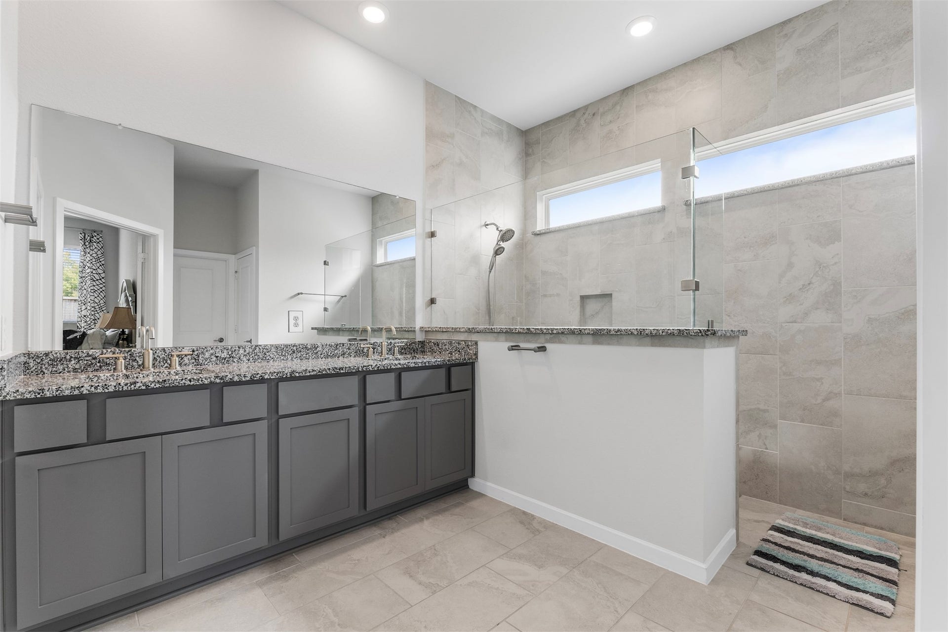22107 Palo Dura Lane, Tomball, TX 77375 Spa-style primary bath with dual sinks and an oversized walk-in shower.